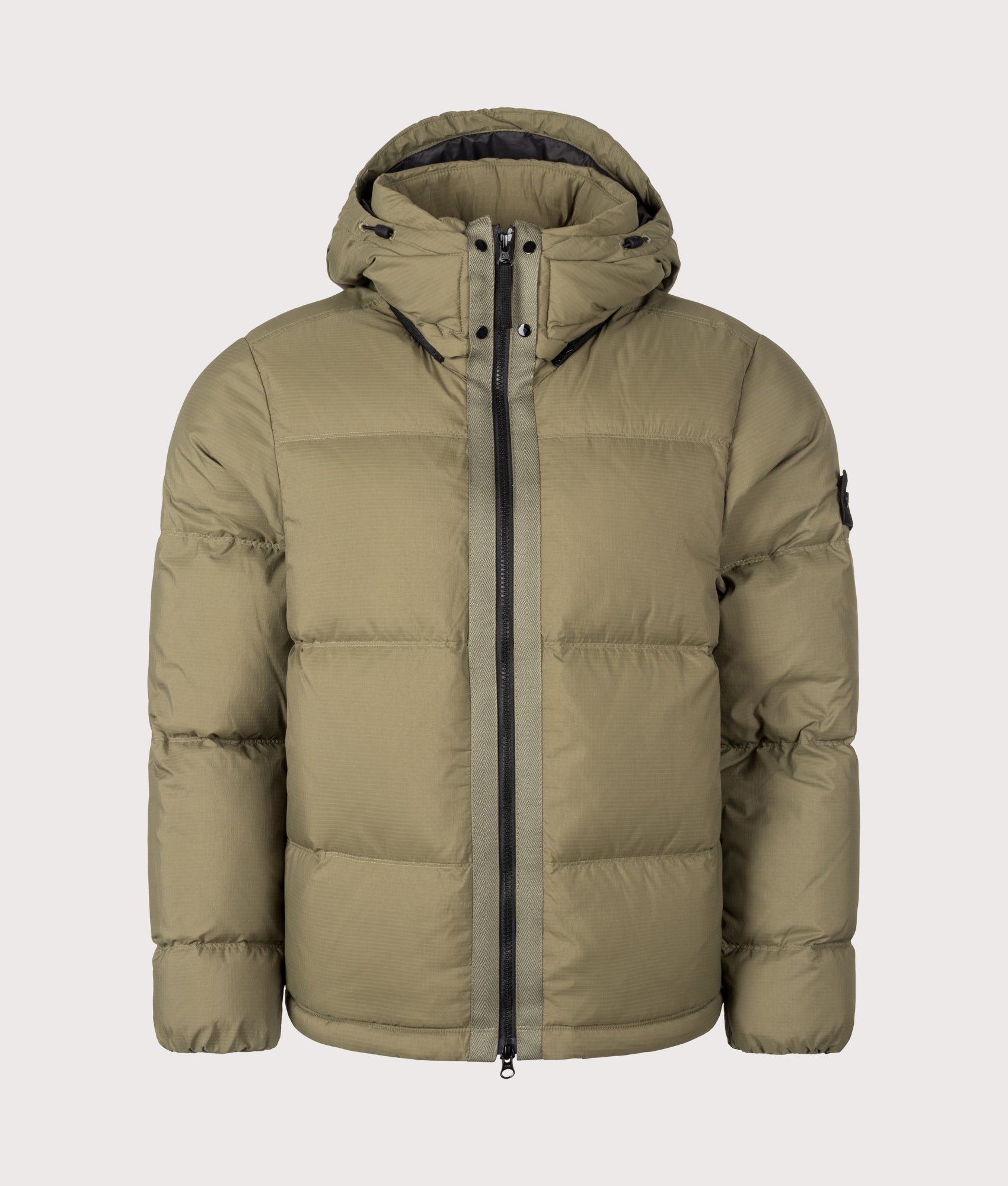Stone Island Matt Ripstop Cordura® Advanced Fabrics Puffer Jacket in Military Green at EQVVS Menswear. Front shot.