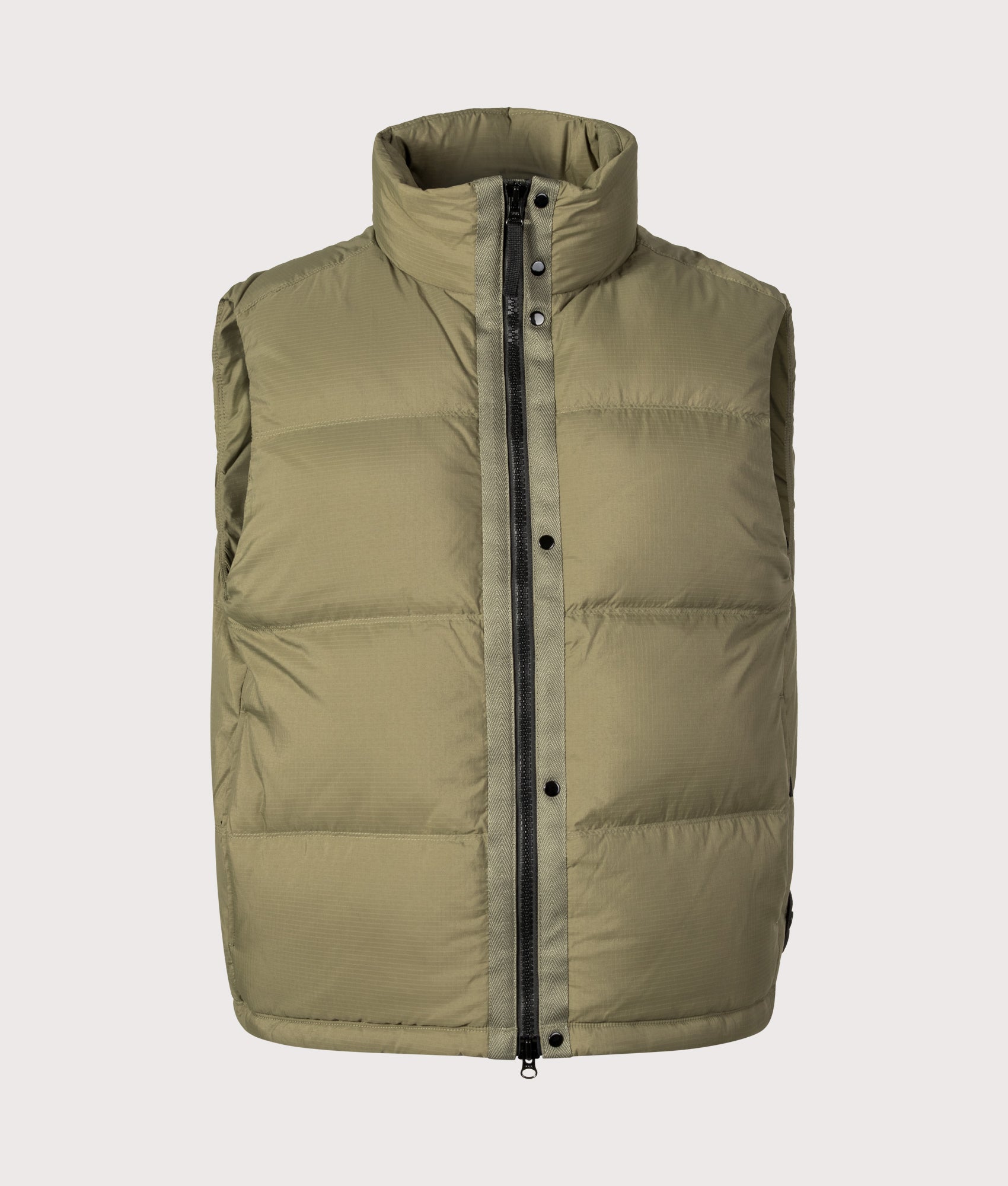 Stone Island Matt Ripstop Cordura® Advanced Fabrics Vest in Military Green at EQVVS Menswear. Front shot.