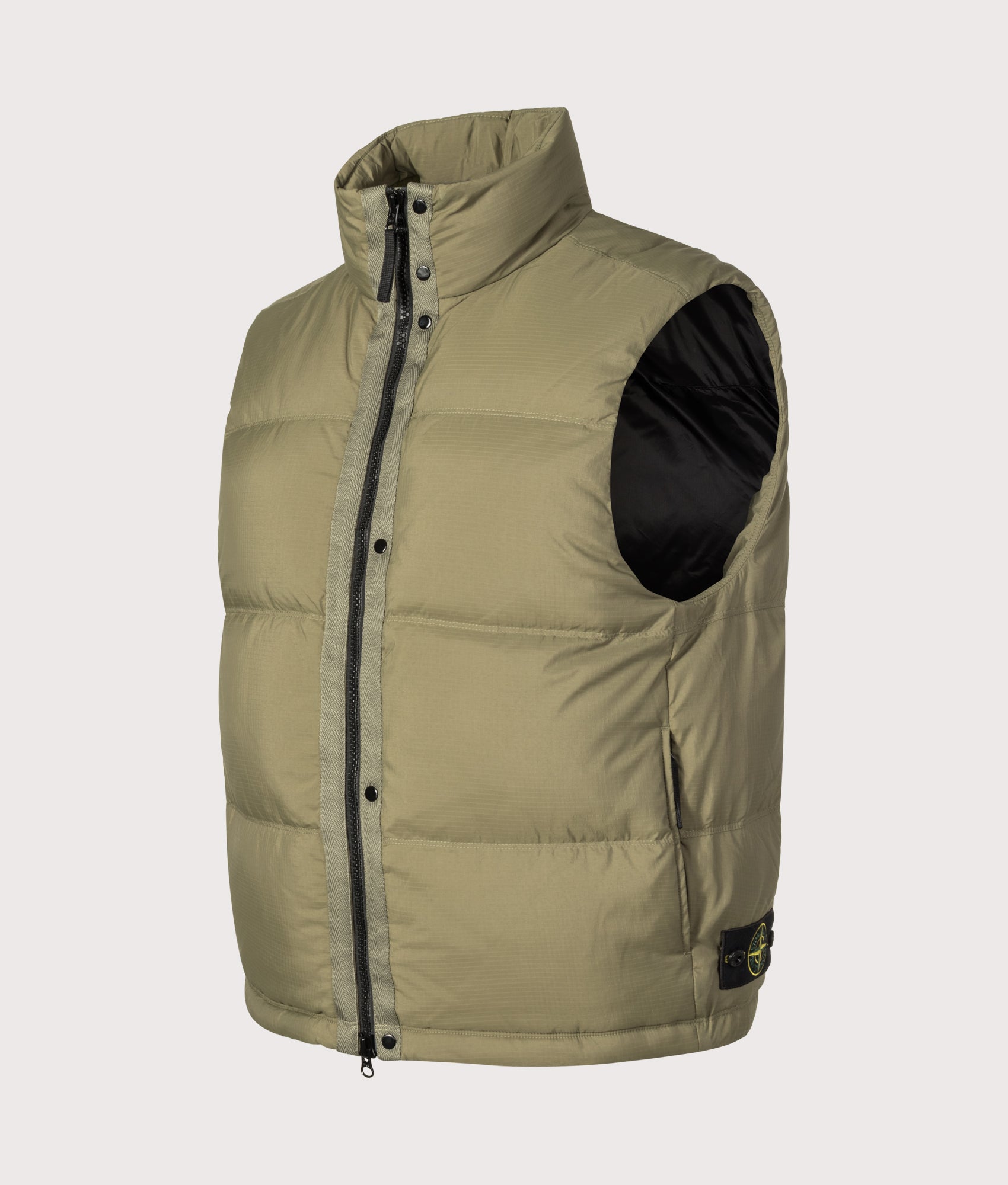 Stone Island Matt Ripstop Cordura® Advanced Fabrics Vest in Military Green at EQVVS Menswear. Angled front shot.