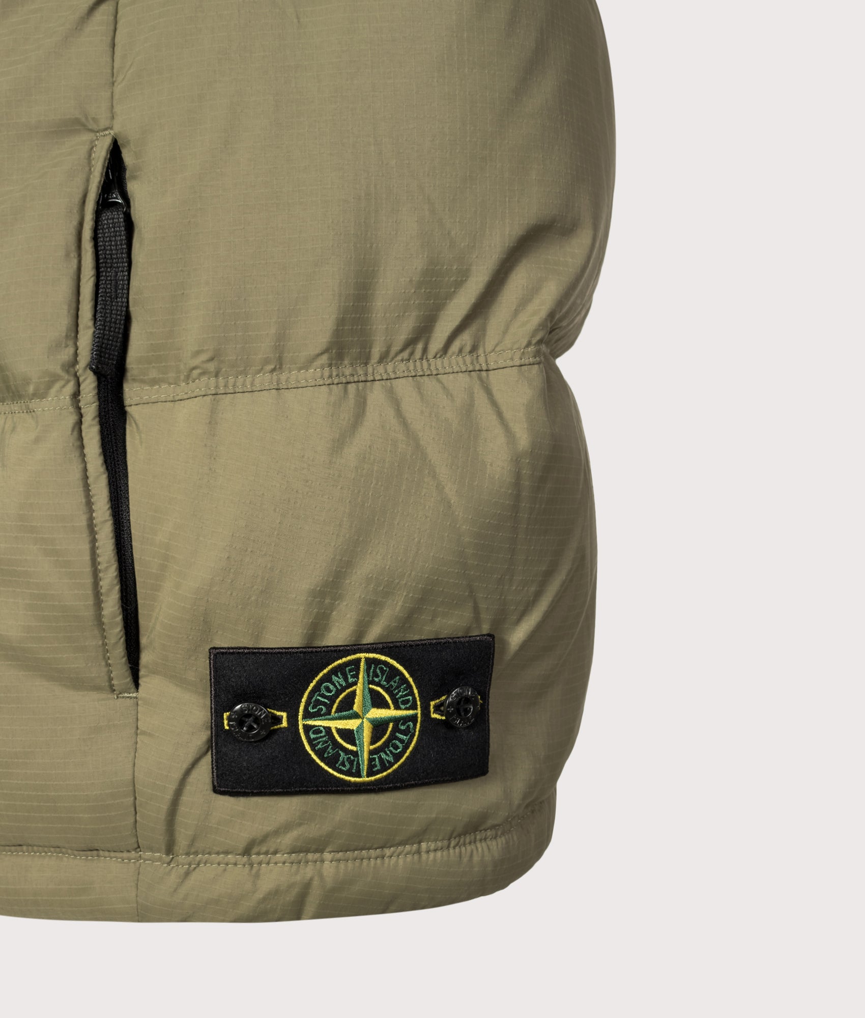 Stone Island Matt Ripstop Cordura® Advanced Fabrics Vest in Military Green at EQVVS Menswear. Detail shot.