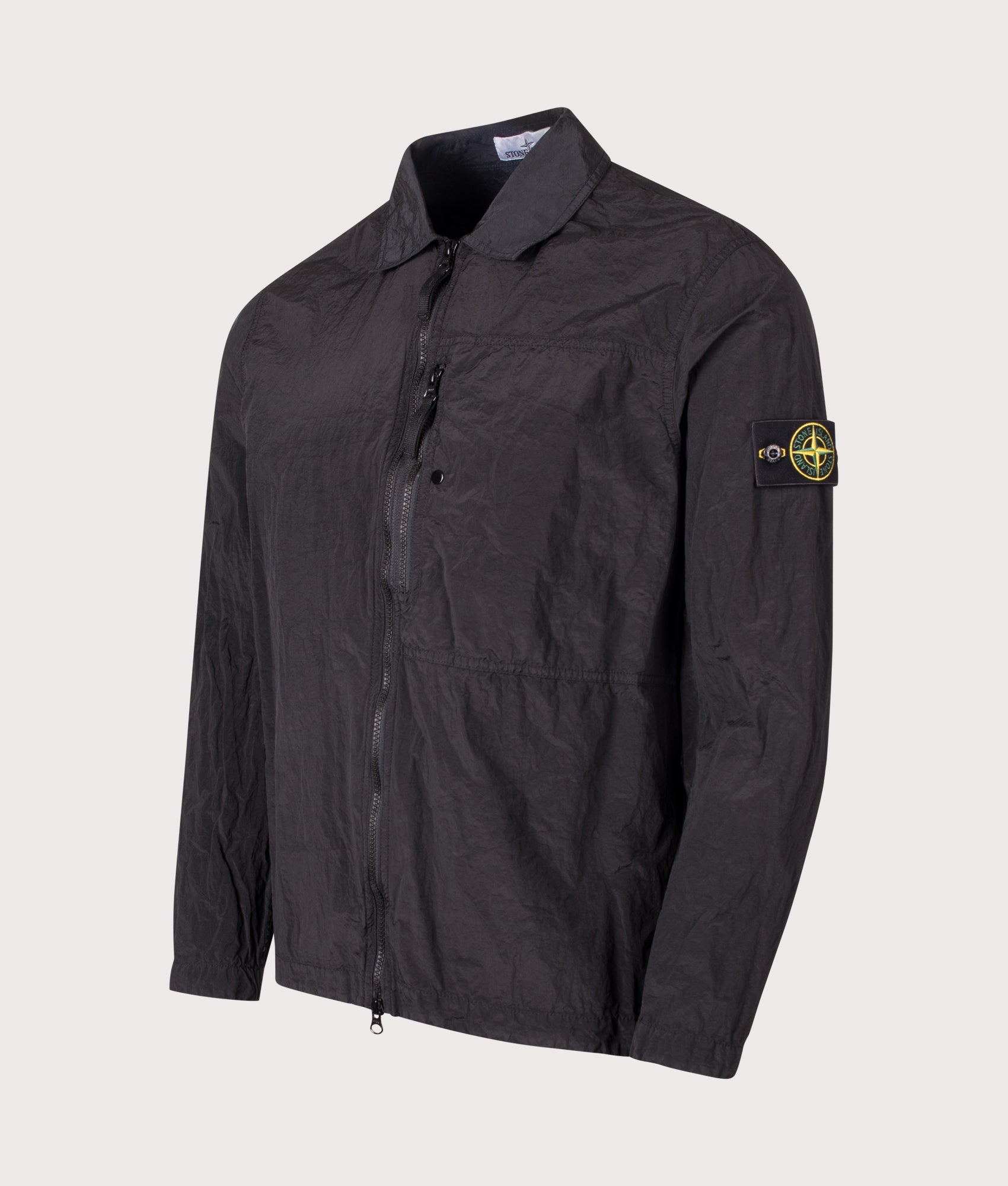 Stone Island Nylon Metal in Econyl® Overshirt in Black at EQVVS Menswear. Angled front shot.