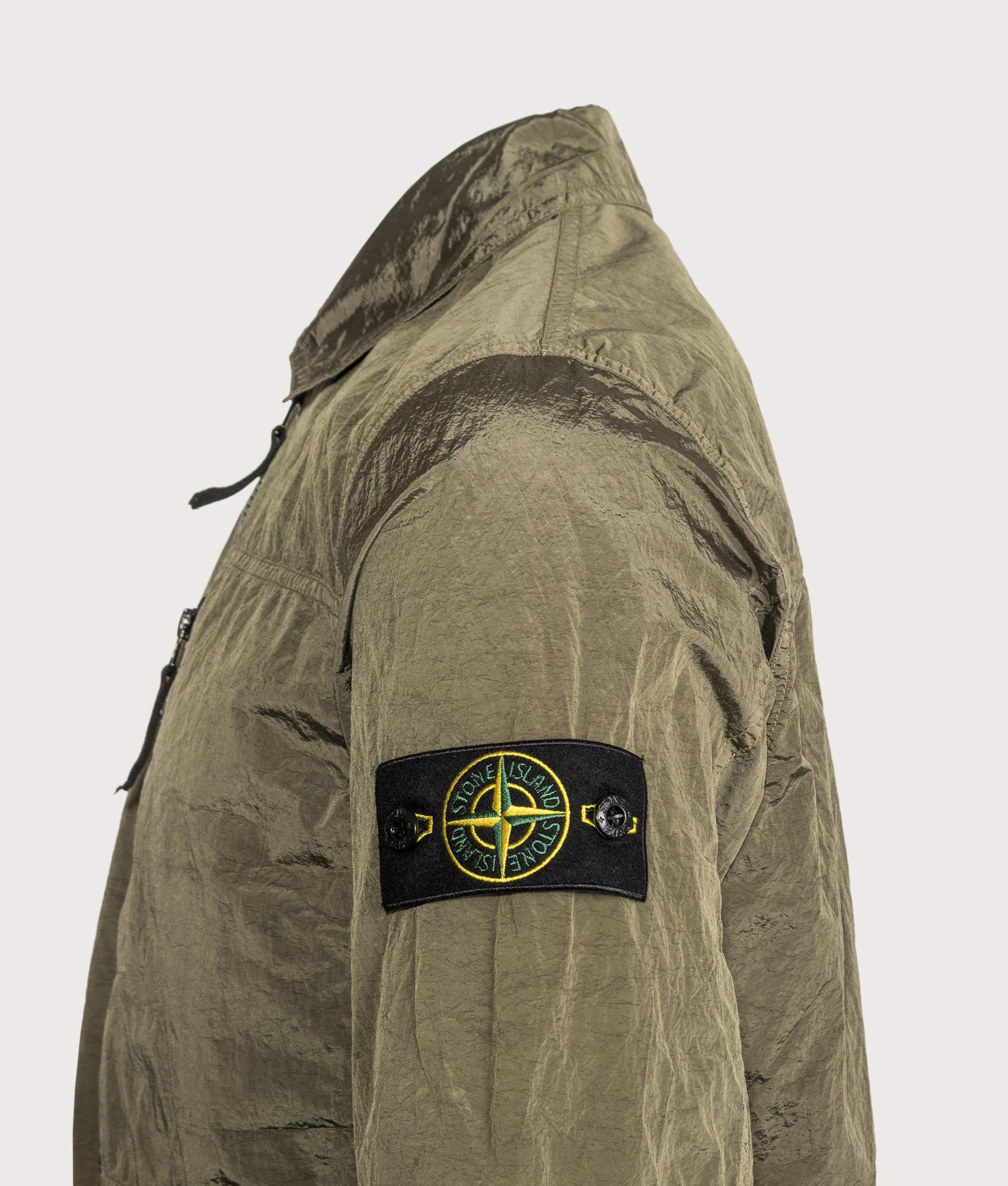 Stone Island Nylon Metal in Econyl® Overshirt in Military Green at EQVVS Menswear. Detail shot.