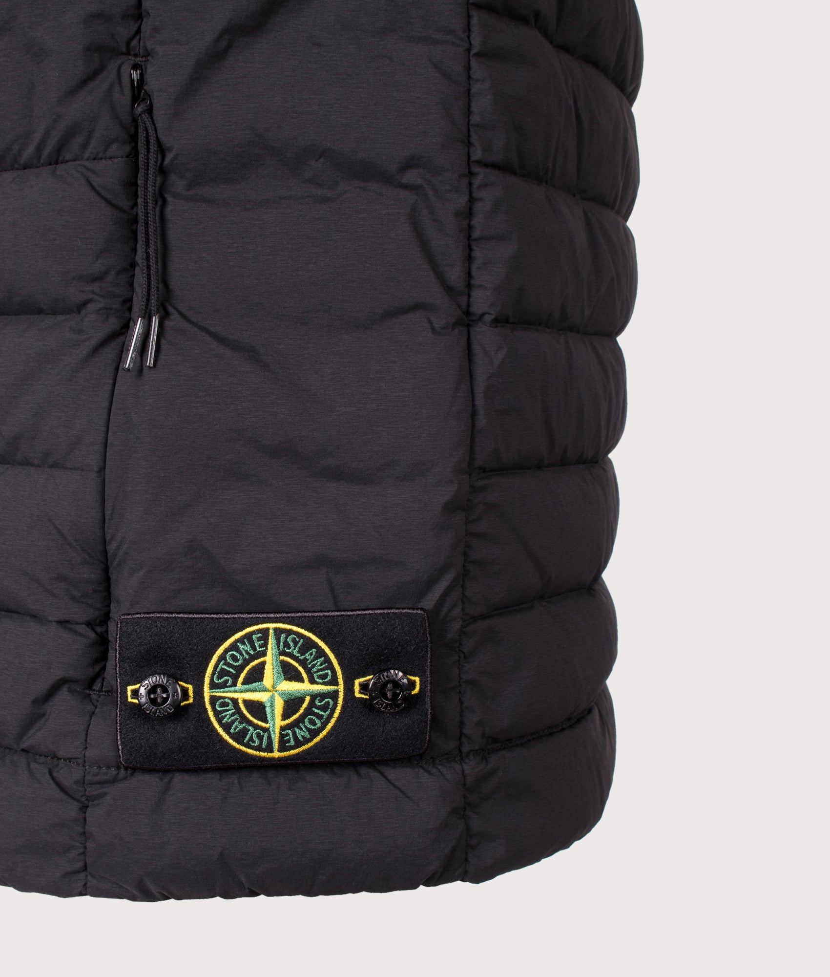 Stone Island Seamless Tunnel Nylon Down-TC Vest in Black at EQVVS Menswear. Detail shot.