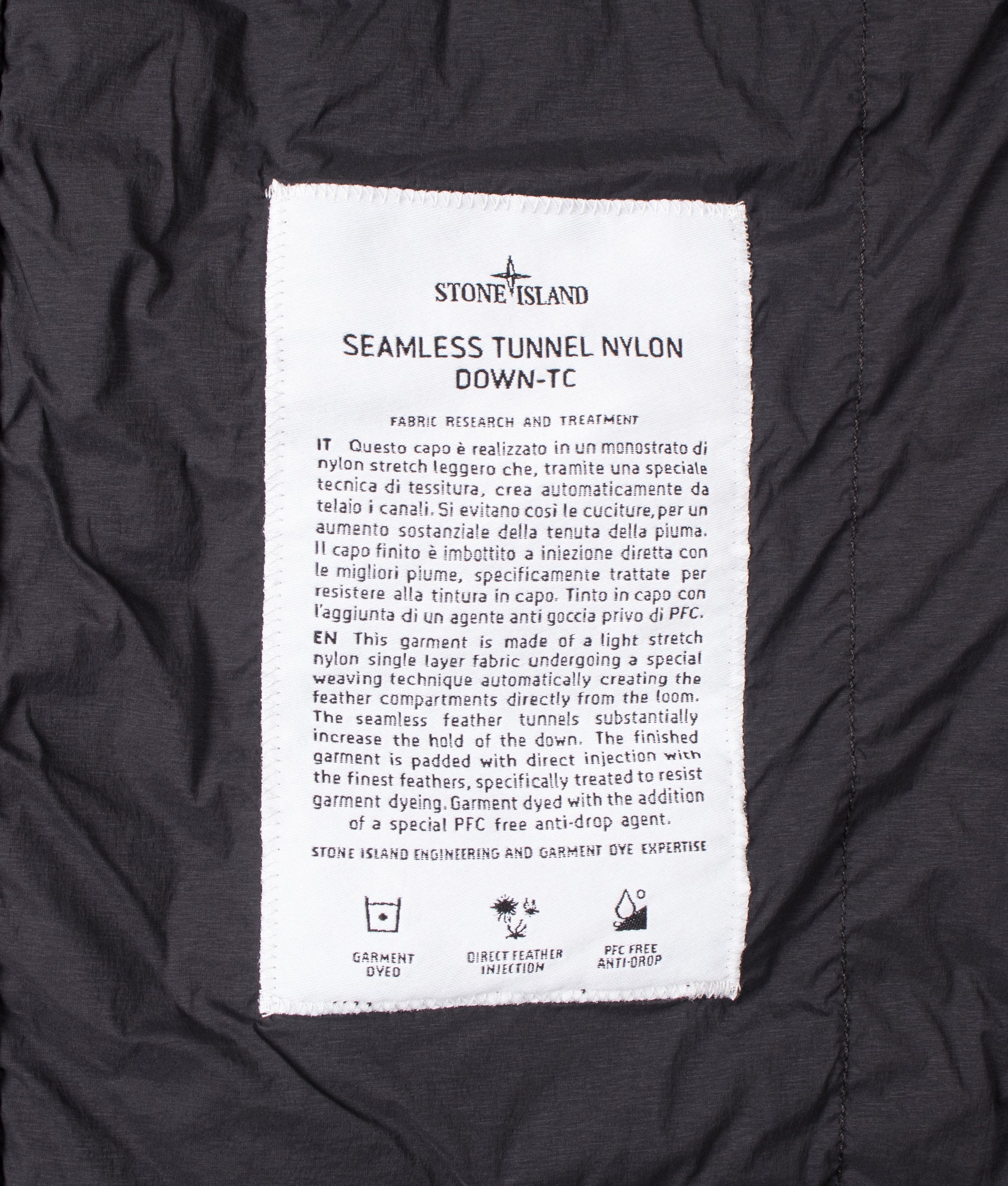 Stone Island Seamless Tunnel Nylon Down-TC Vest in Black at EQVVS Menswear. Label shot.