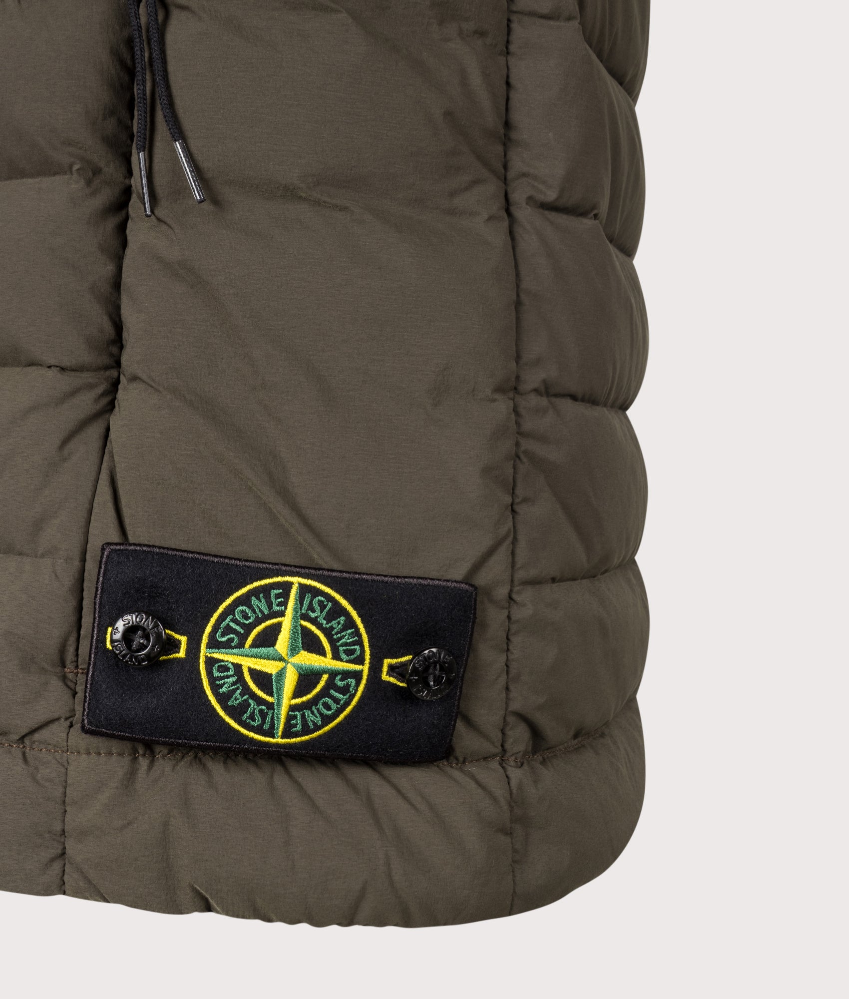 Stone Island Seamless Tunnel Nylon Down-TC Vest in Coal Grey at EQVVS Menswear. Detail shot.
