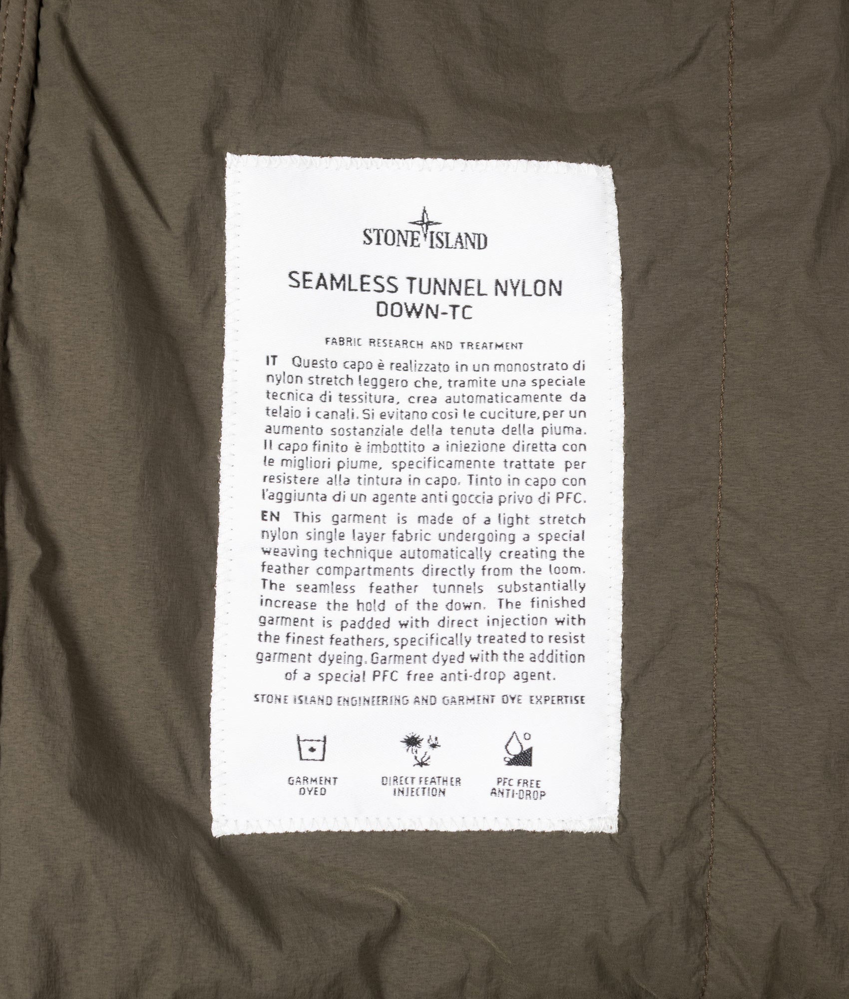 Stone Island Seamless Tunnel Nylon Down-TC Vest in Coal Grey at EQVVS Menswear. Label shot.
