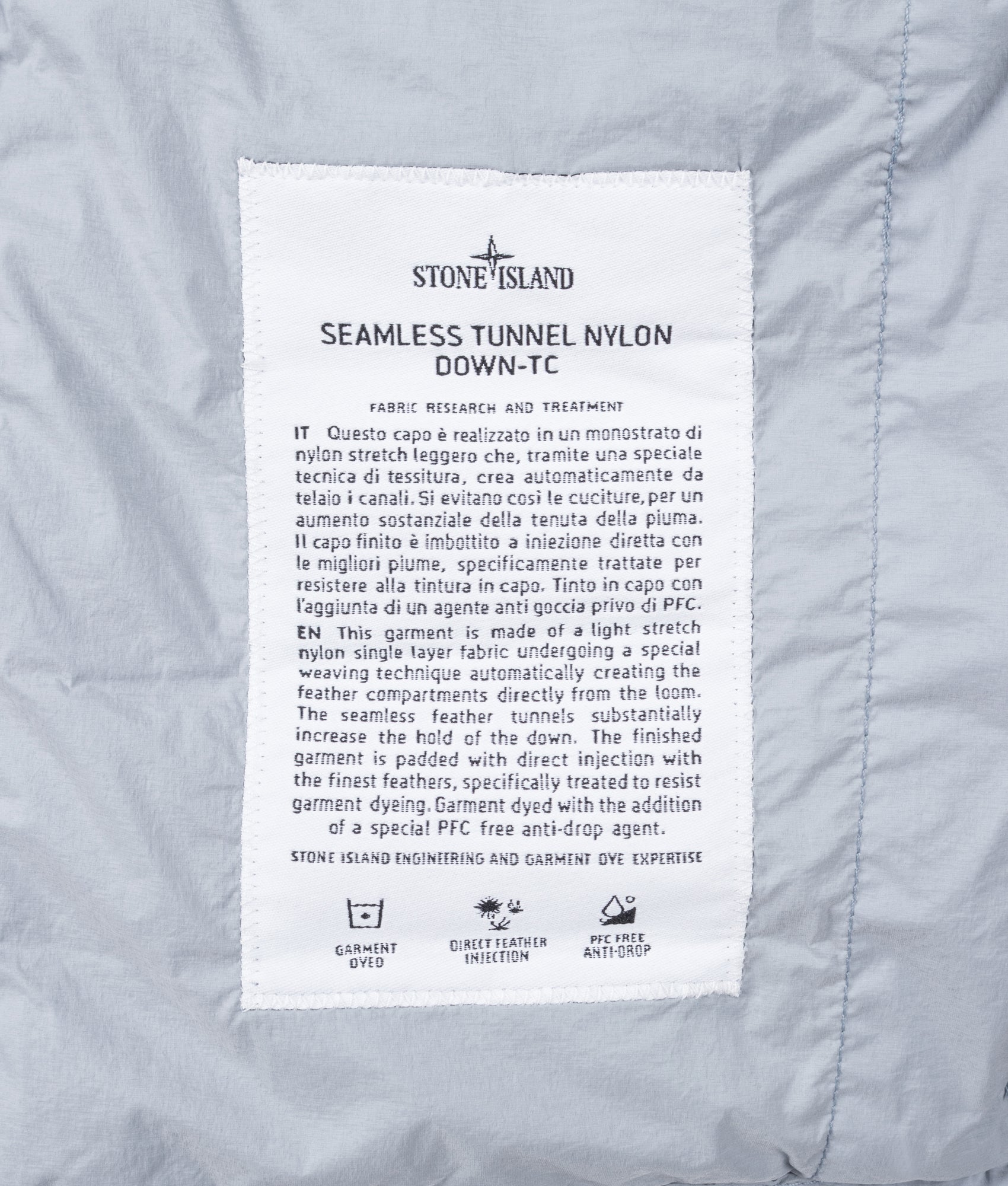 Stone Island Seamless Tunnel Nylon Down-TC Vest in Ash Grey at EQVVS Menswear. Label shot.