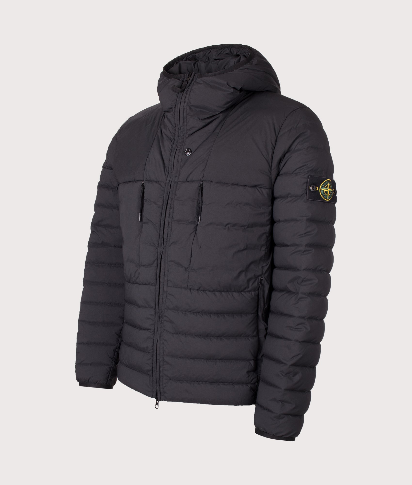 Stone Island Seamless Tunnel Nylon Down-TC Jacket in Black at EQVVS Menswear. Angled front shot.