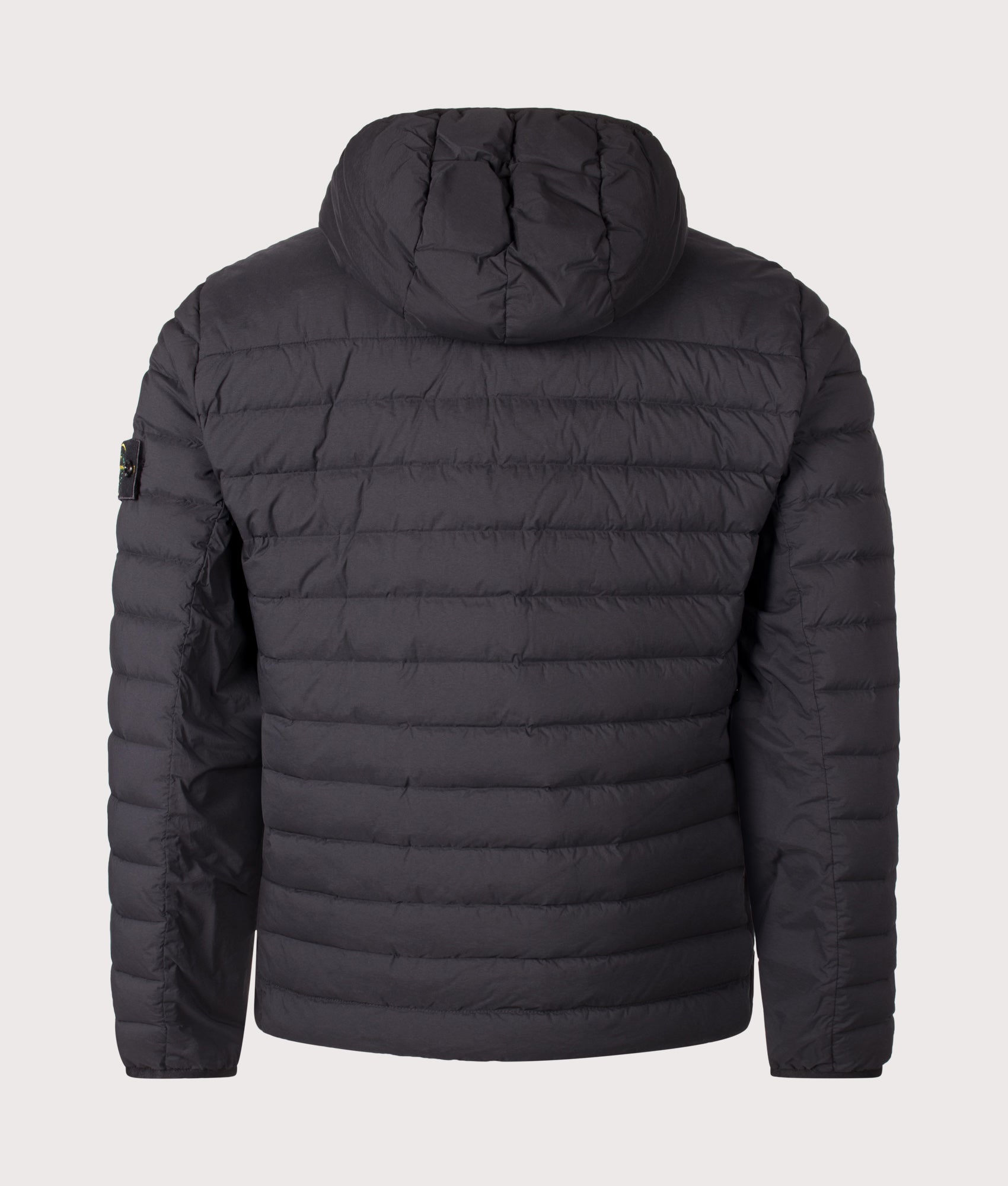 Stone Island Seamless Tunnel Nylon Down-TC Jacket in Black at EQVVS Menswear. Back shot.