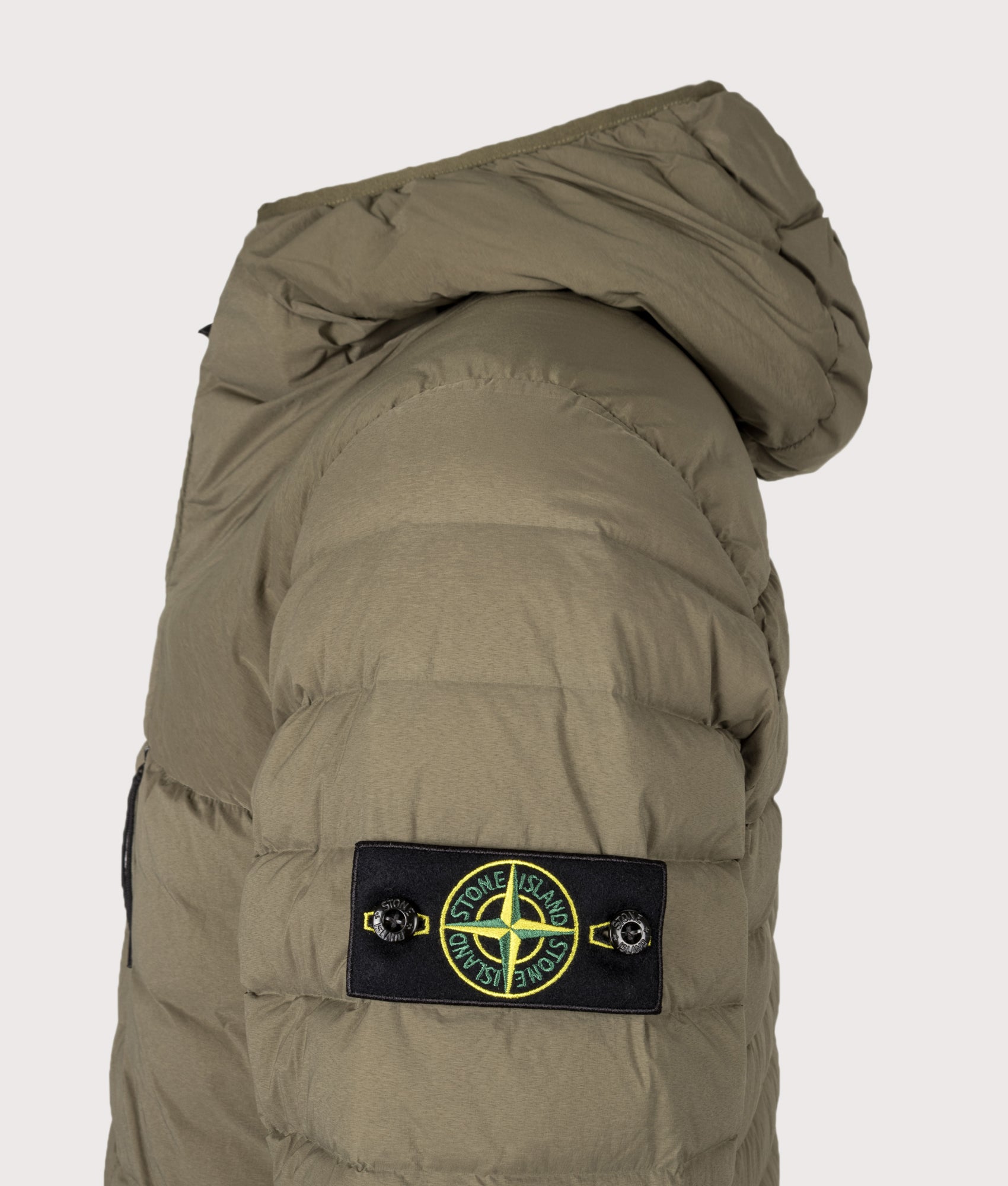 Stone Island Seamless Tunnel Nylon Down-TC Jacket in Military Green at EQVVS Menswear. Detail shot.