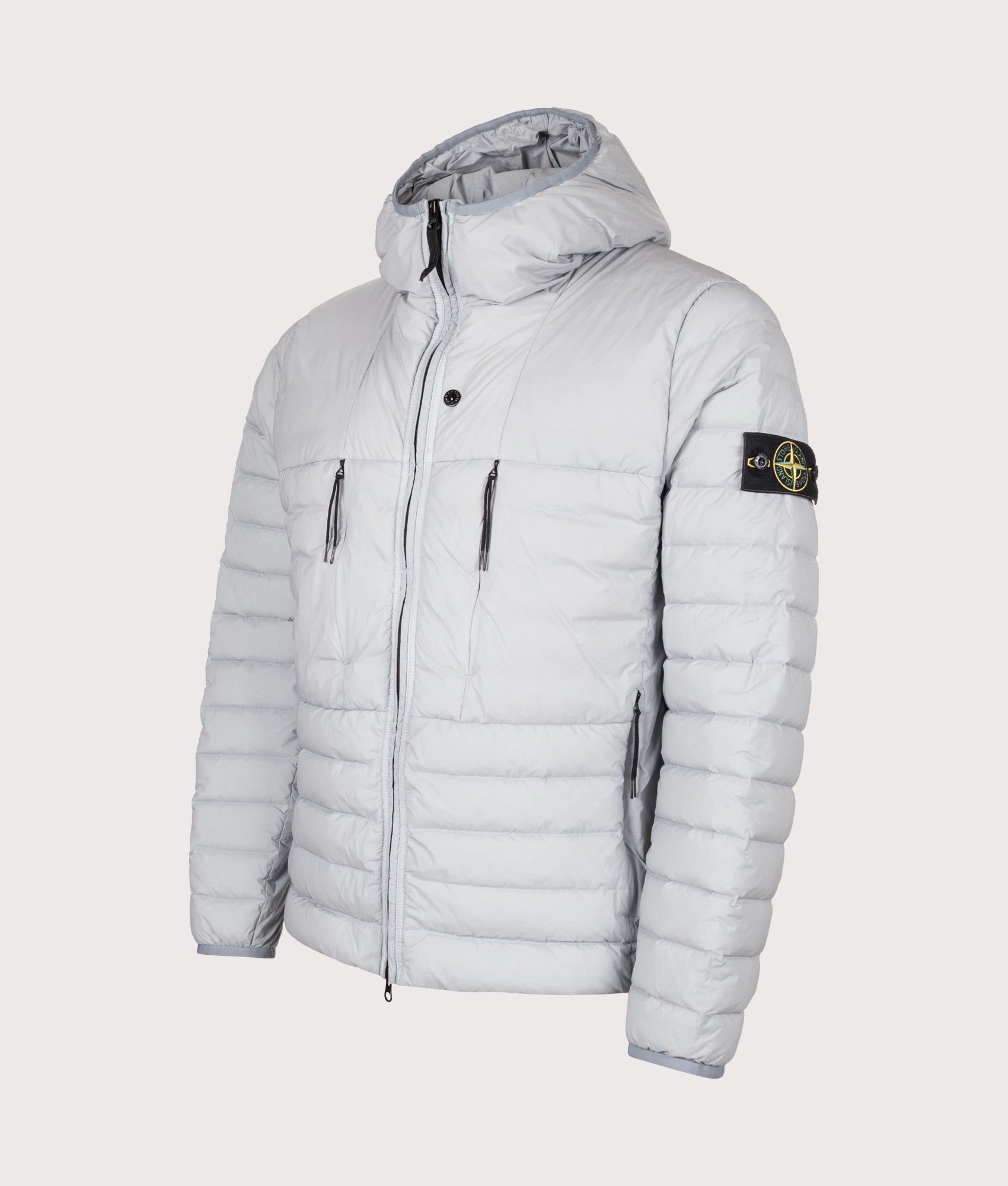 Stone Island Seamless Tunnel Nylon Down-TC Jacket in Ash Grey at EQVVS Menswear. Angled front shot.