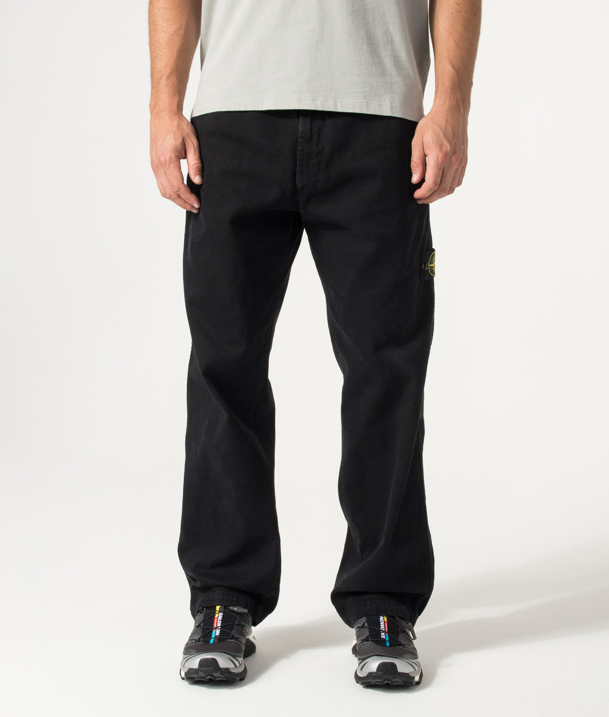Stone Island Loose Fit Organic Panama Cotton 'Old' Effect Trousers in Black at EQVVS Menswear. Model front shot.