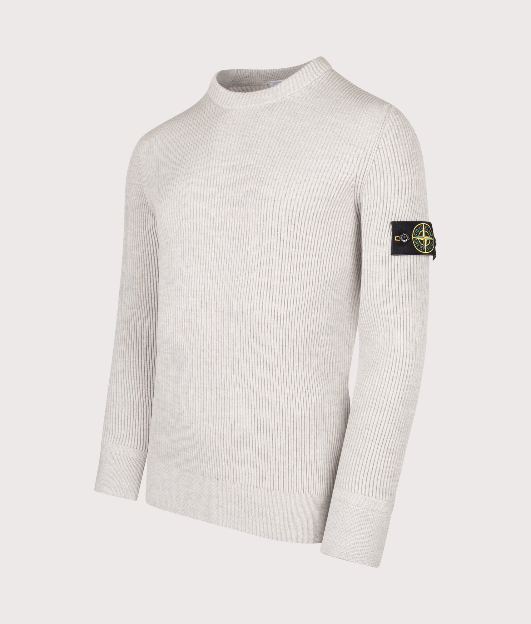 Stone Island Full Rib RWS Wool Jumper in Medium Beige at EQVVS Menswear. Angled front shot.