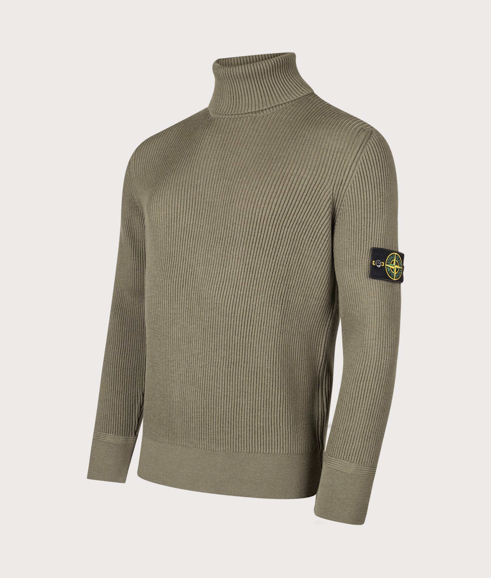 Stone Island Full Rib RWS Wool Turtle Neck Jumper in Military Green at EQVVS Menswear. Angled front shot.