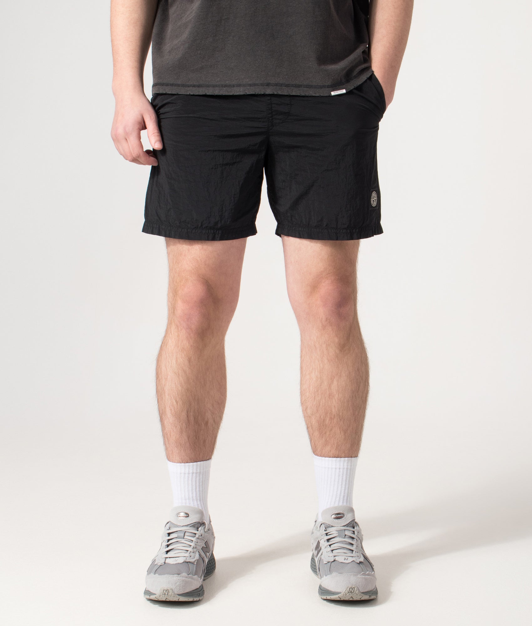 Stone Island Compass Swim Shorts in Black at EQVVS Menswear. Front shot.
