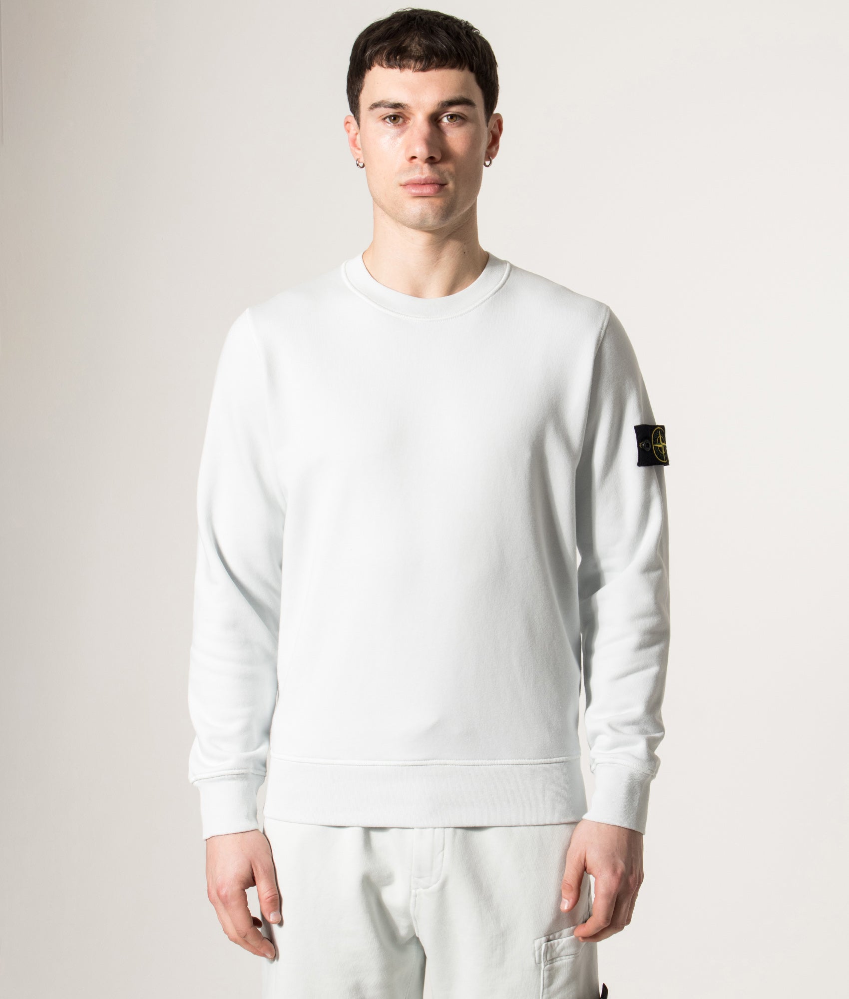 Stone Island Organic Cotton Crewneck Sweatshirt in Sky Blue at EQVVS Menswear. Model front shot.