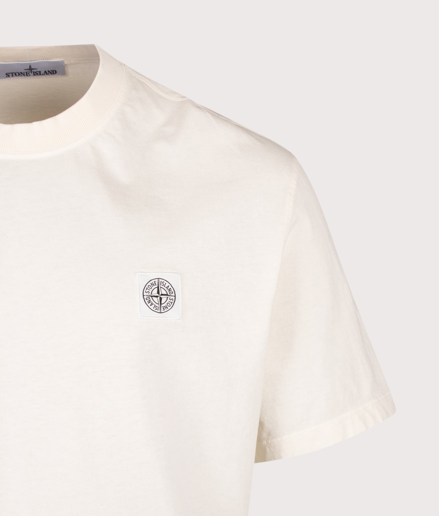 Stone Island Combed Organic Cotton Jersey T-Shirt in Ivory at EQVVS Menswear. Detail shot.