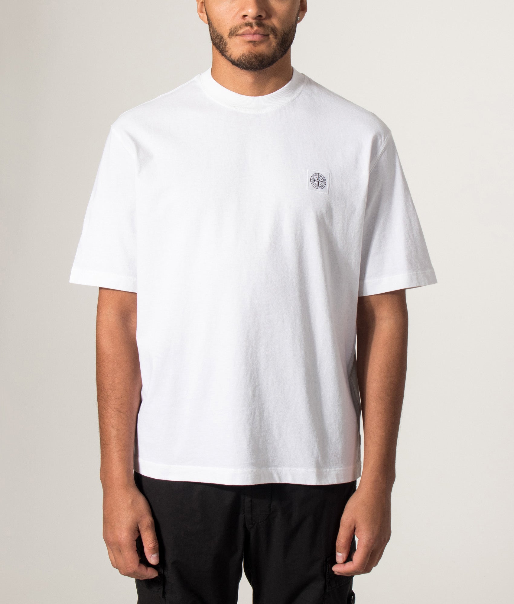 Stone Island Combed Organic Cotton Jersey T-Shirt in White at EQVVS Menswear. Model front shot.