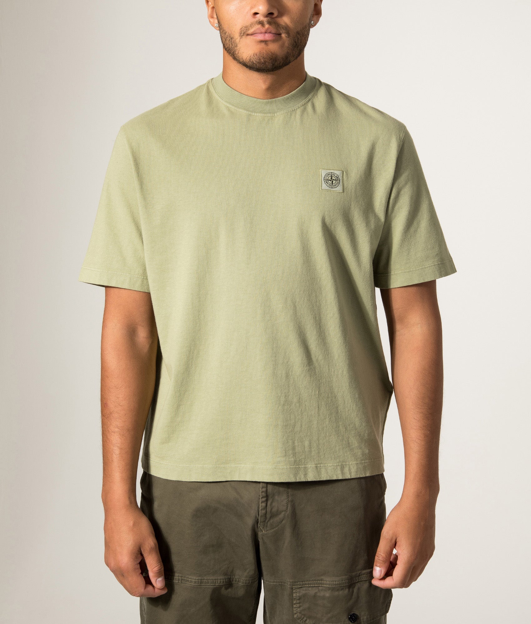 Stone Island Combed Organic Cotton Jersey T-Shirt in Laurel Green at EQVVS Menswear. Model front shot.