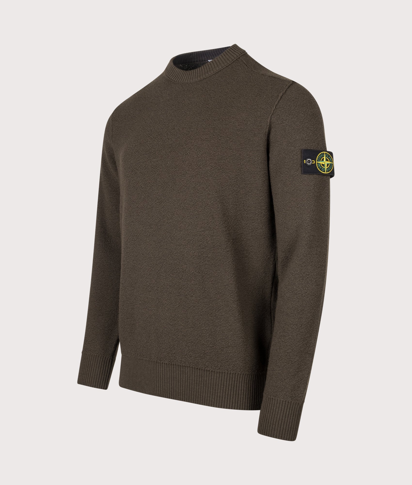 Stone Island Loose Fit Pure RWS Wool Jumper in Coal Grey at EQVVS Menswear. Angled front shot.
