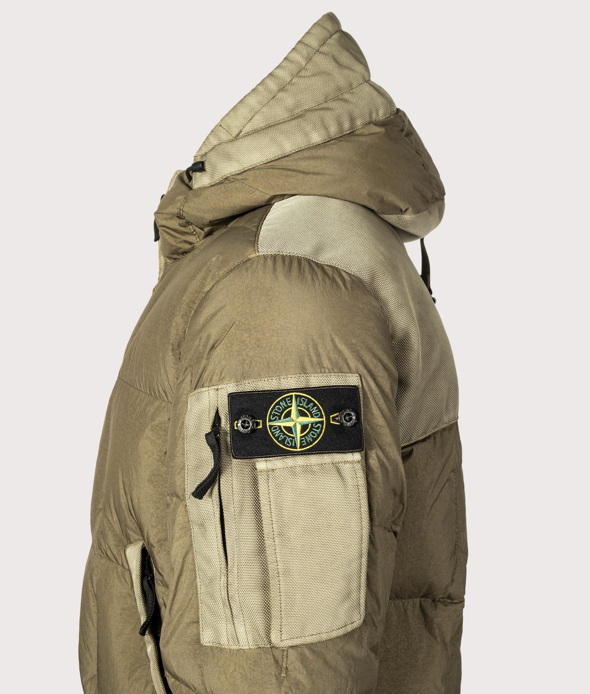 Stone Island Garment Dyed Crinkle Reps NY Down Jacket in Military Green at EQVVS Menswear. Detail shot.