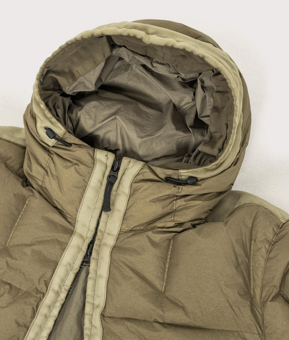 Stone Island Garment Dyed Crinkle Reps NY Down Jacket in Military Green at EQVVS Menswear. Hood shot.
