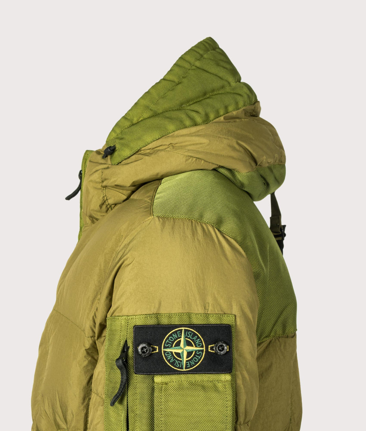 Stone Island Garment Dyed Crinkle Reps NY Down Jacket in Cactus at EQVVS Menswear. Detail Shot.