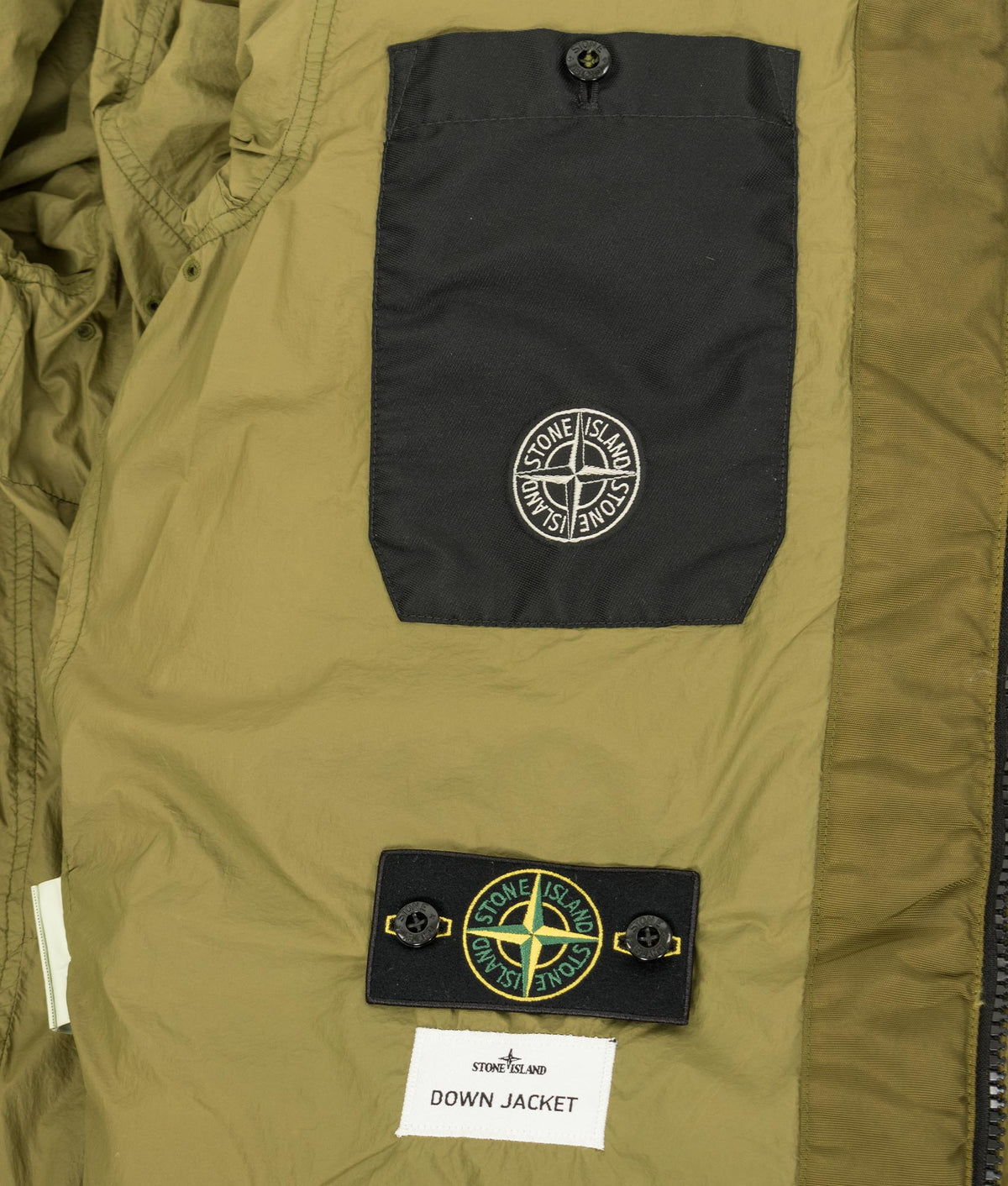 Stone Island Garment Dyed Crinkle Reps NY Down Jacket in Cactus at EQVVS Menswear. Inside detail shot.