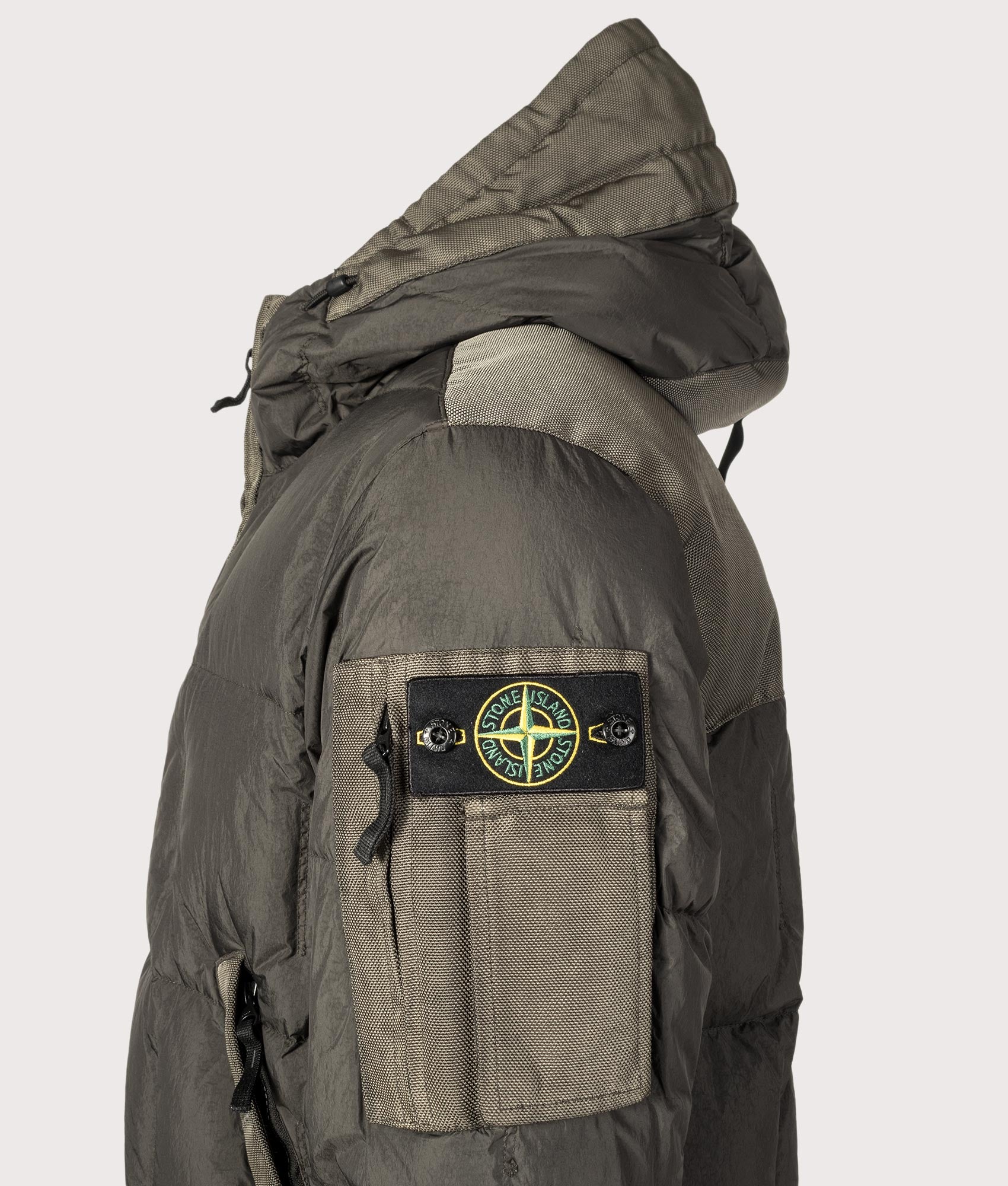 Stone Island Garment Dyed Crinkle Reps NY Down Jacket in Lead Grey at EQVVS Menswear. Detail shot.