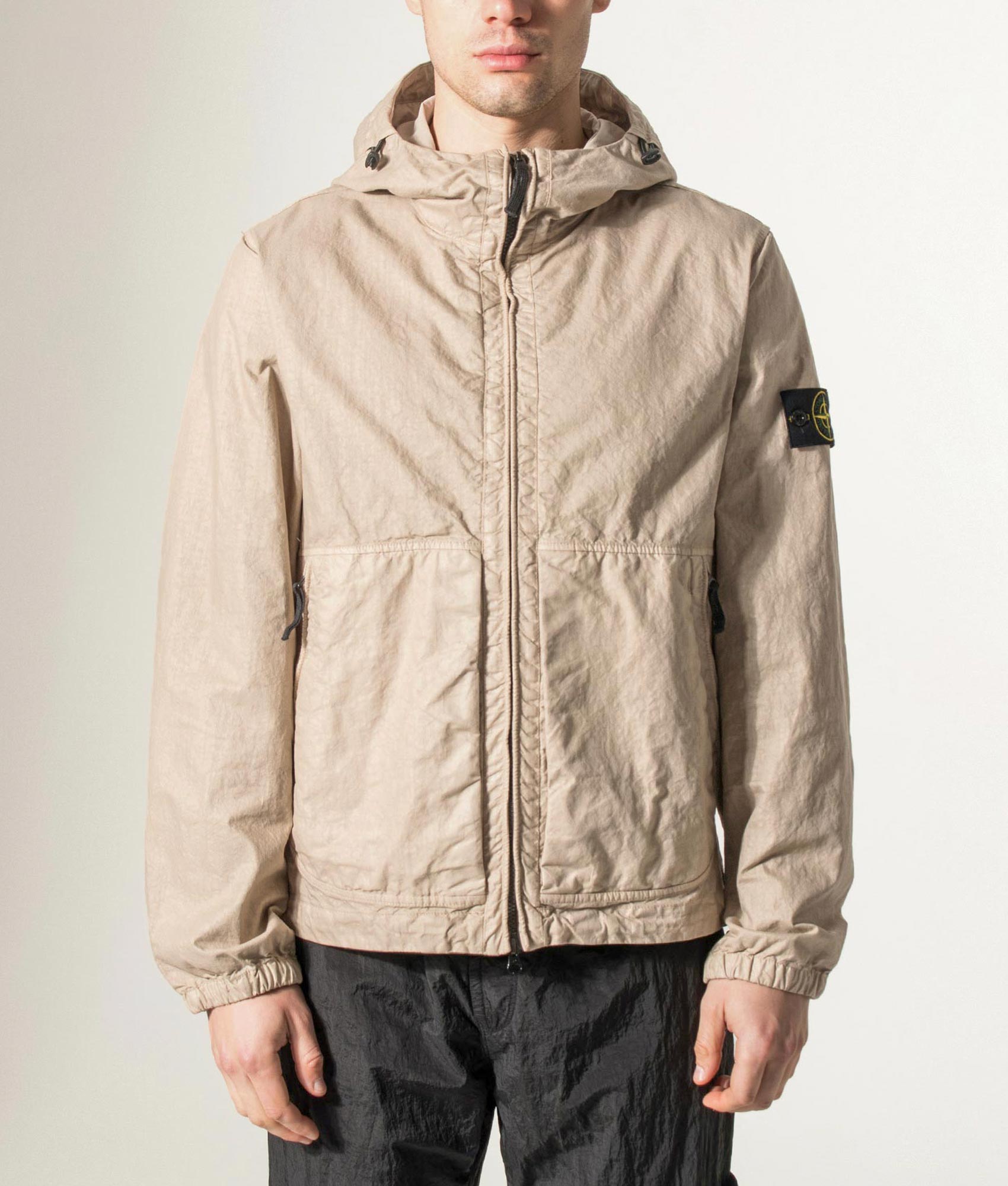 Stone Island Organic-Look Nylon Panama-TC Jacket in Desert sand at EQVVS Menswear. Model front shot.