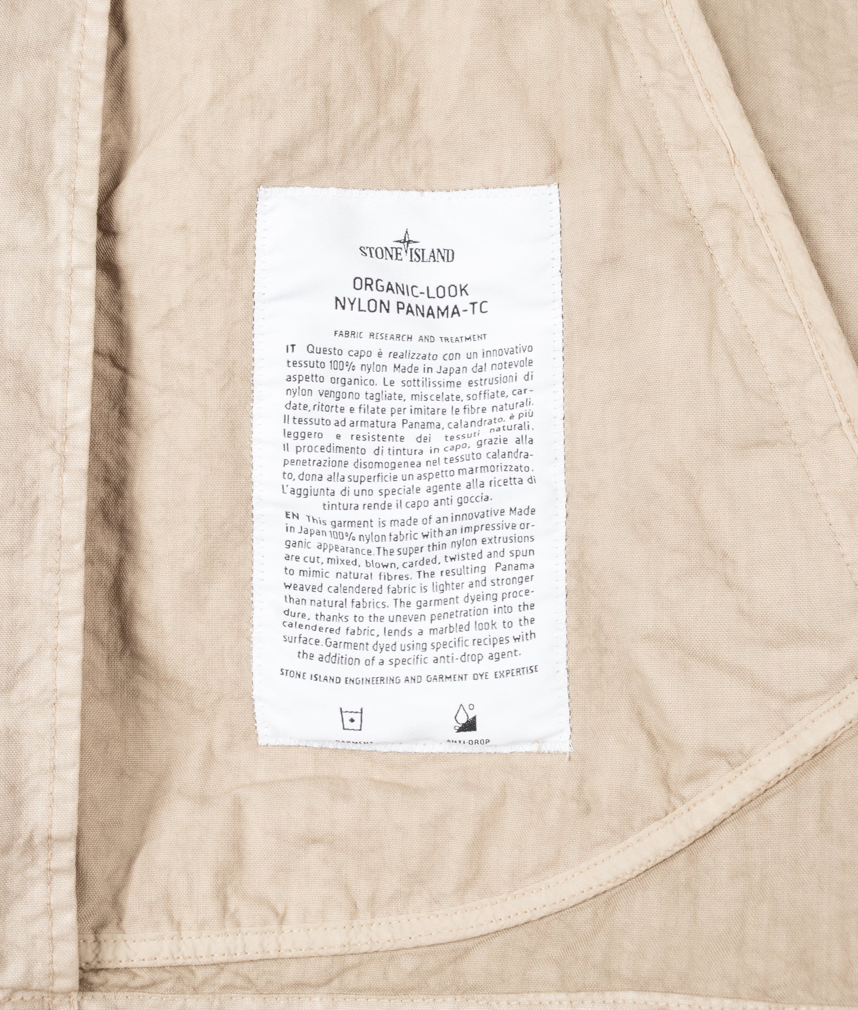 Stone Island Organic-Look Nylon Panama-TC Jacket in Desert sand at EQVVS Menswear. Label shot.