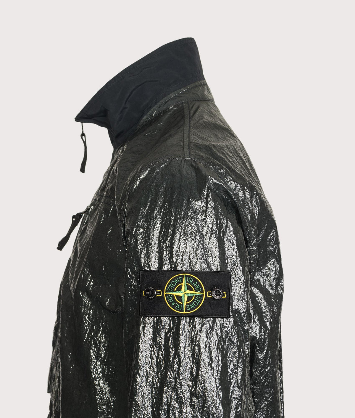 Stone Island Comfort Fit Nylon Lucido Overshirt in Dark Green at EQVVS Menswear. Detail shot.