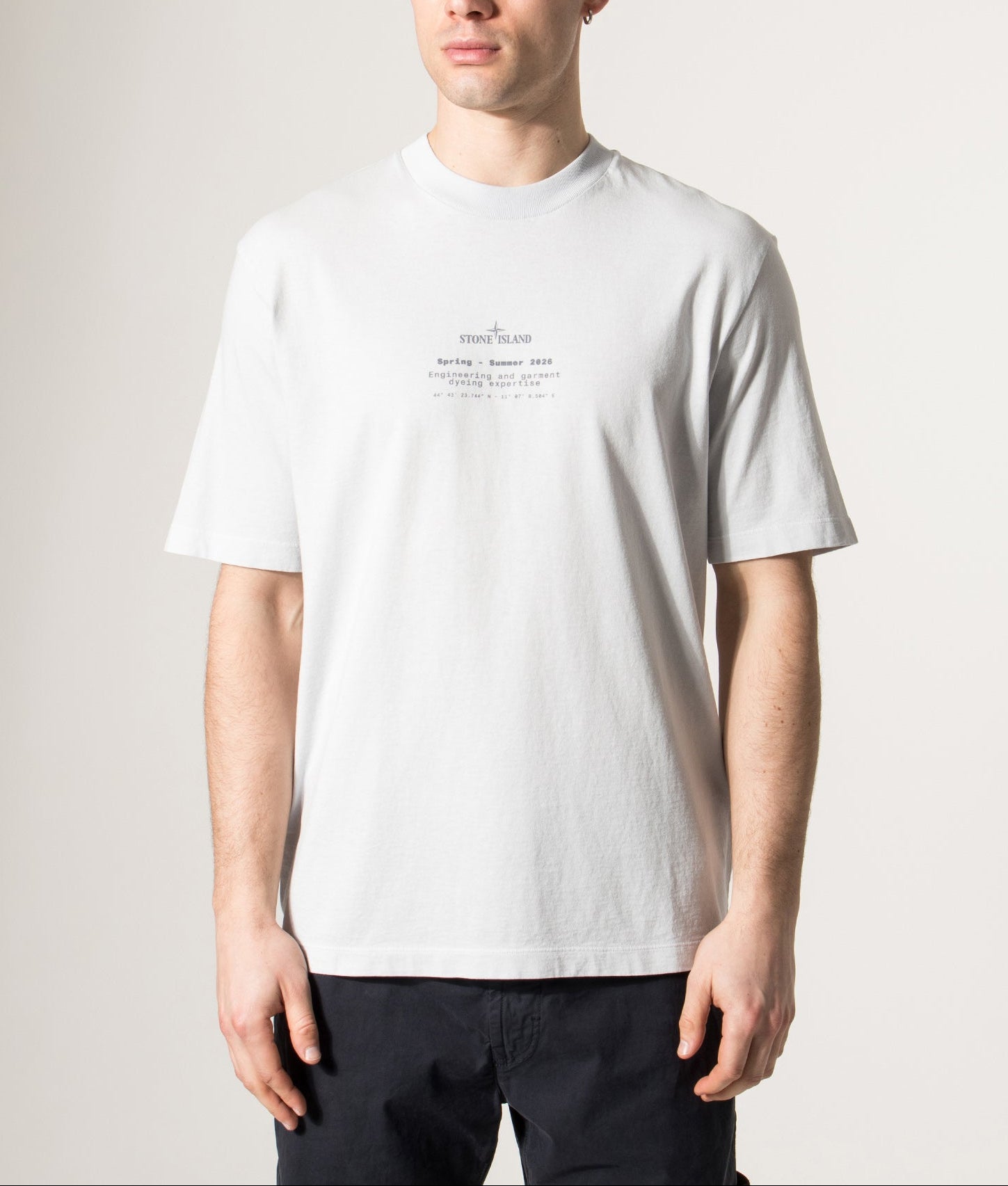 Stone Island Relaxed Fit Stone Back Print T-Shirt in Sky Blue at EQVVS Menswear. Model front shot.