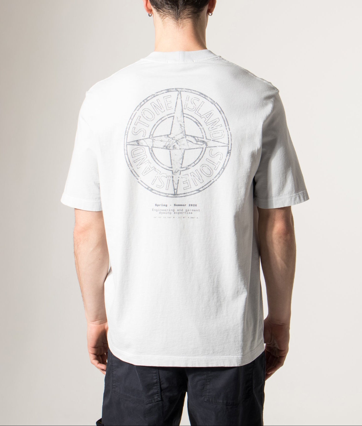 Stone Island Relaxed Fit Stone Back Print T-Shirt in Sky Blue at EQVVS Menswear. Model back shot.