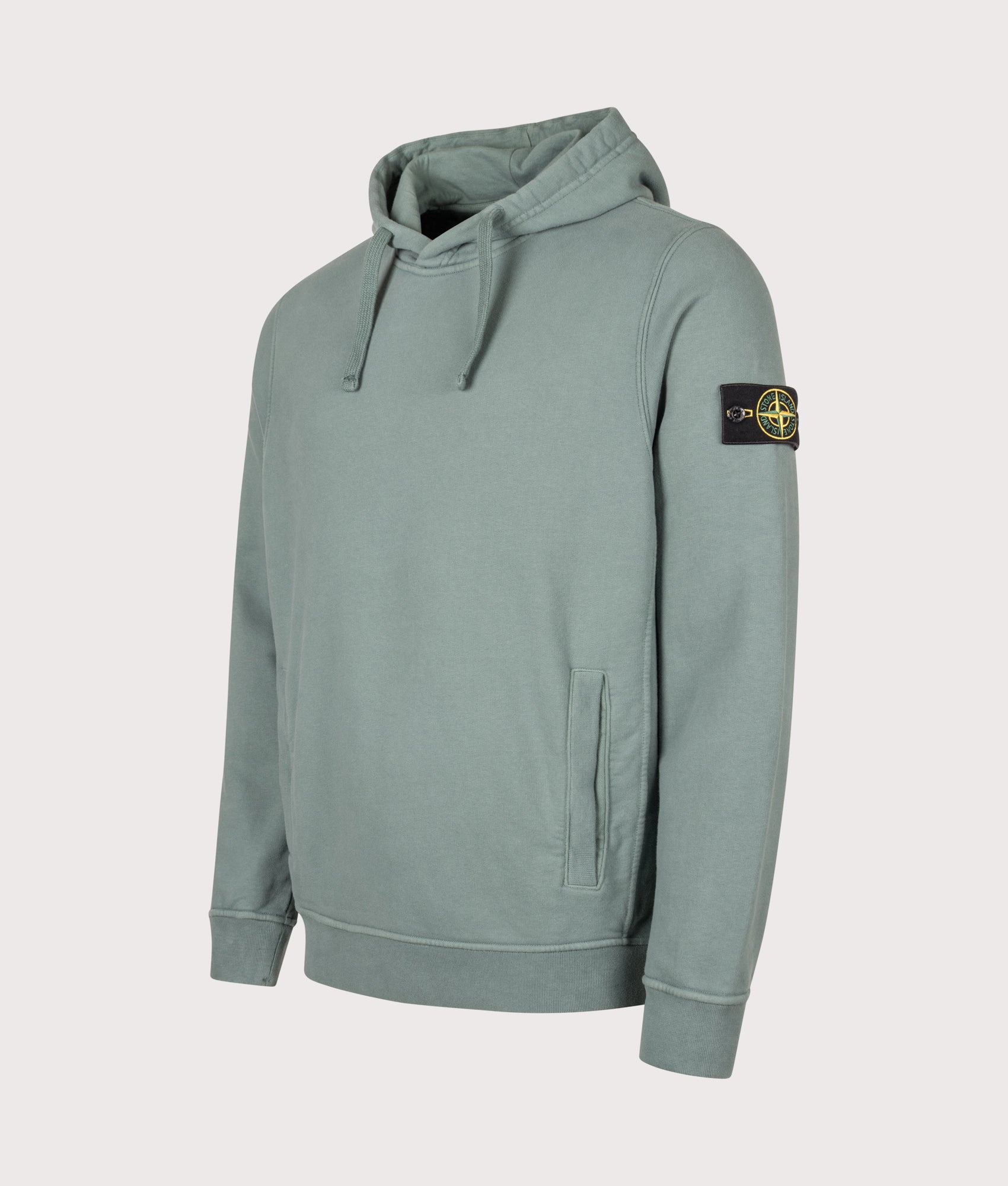 Stone Island Brushed Organic Cotton Fleece Hoodie in Ocean Green at EQVVS Menswear. Angled front shot.