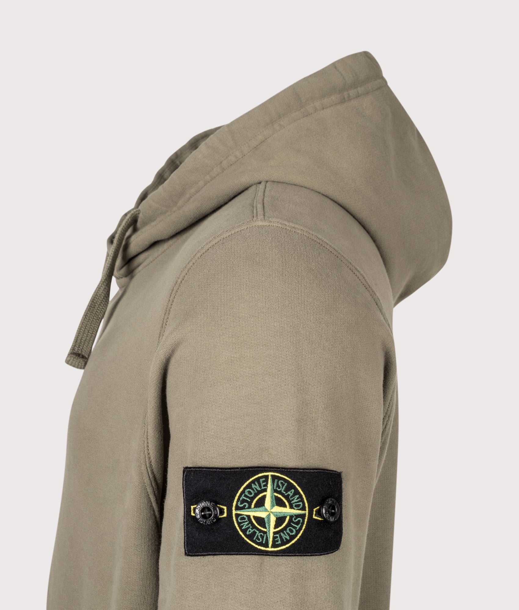 Stone Island Brushed Organic Cotton Fleece Hoodie in Military Green at EQVVS Menswear. Detail shot.