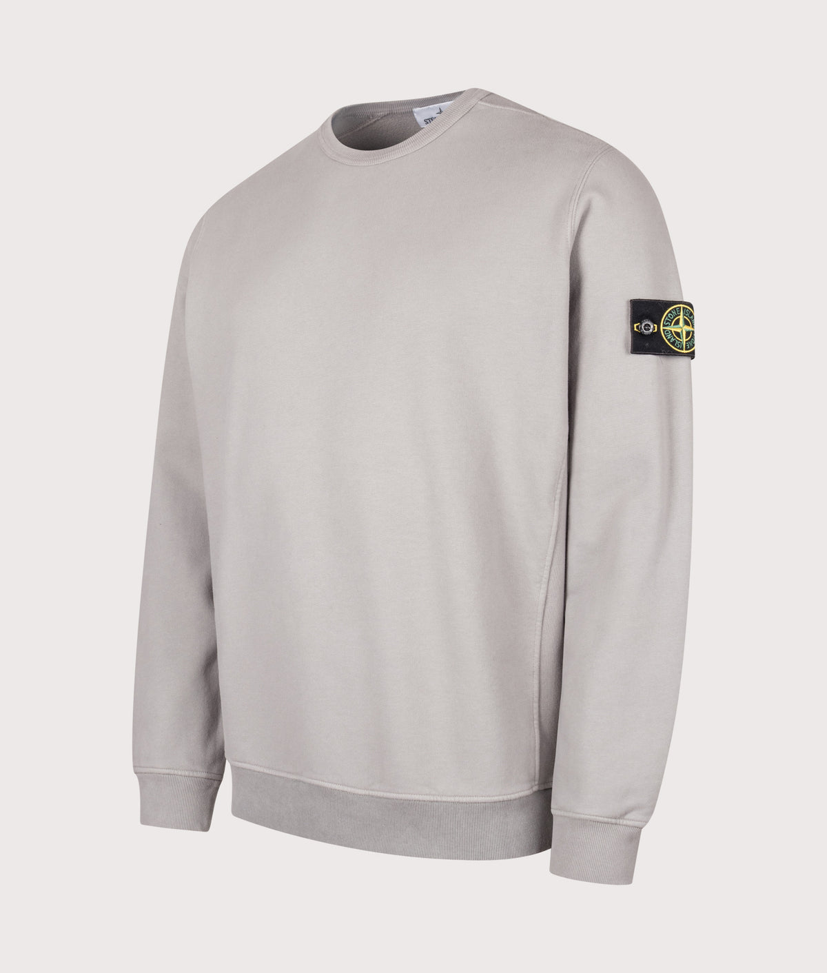 Stone Island Brushed Organic Cotton Fleece Sweatshirt in Gray at EQVVS Menswear. Angled front shot.