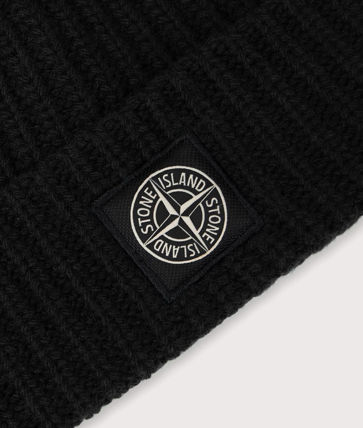 Stone Island Light RWS Geelong Wool Beanie in Black at EQVVS Menswear. Detail shot.