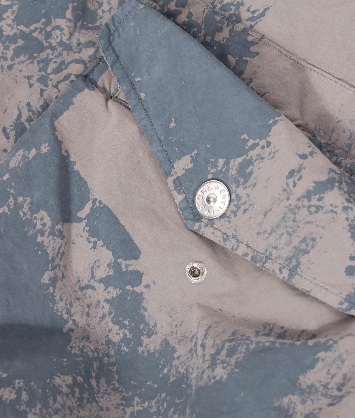 Stone Island Hand Painted David Light-TC Parka in Gray at EQVVS Menswear. Detail shot.