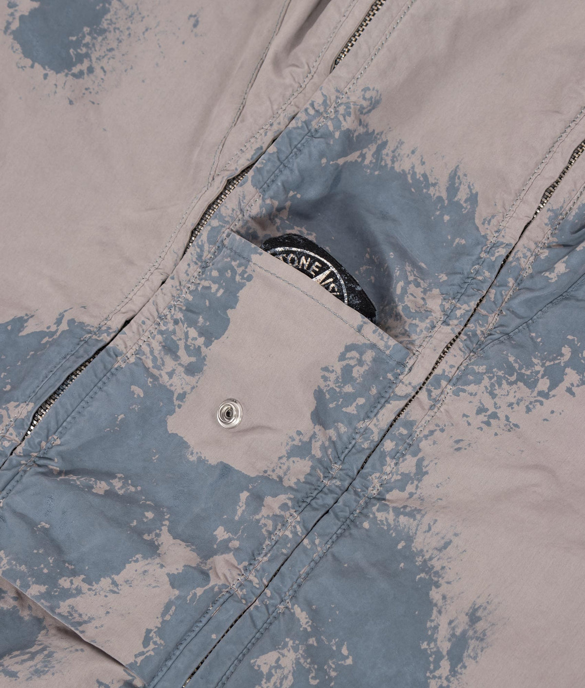 Stone Island Hand Painted David Light-TC Parka in Gray at EQVVS Menswear. Detail shot.