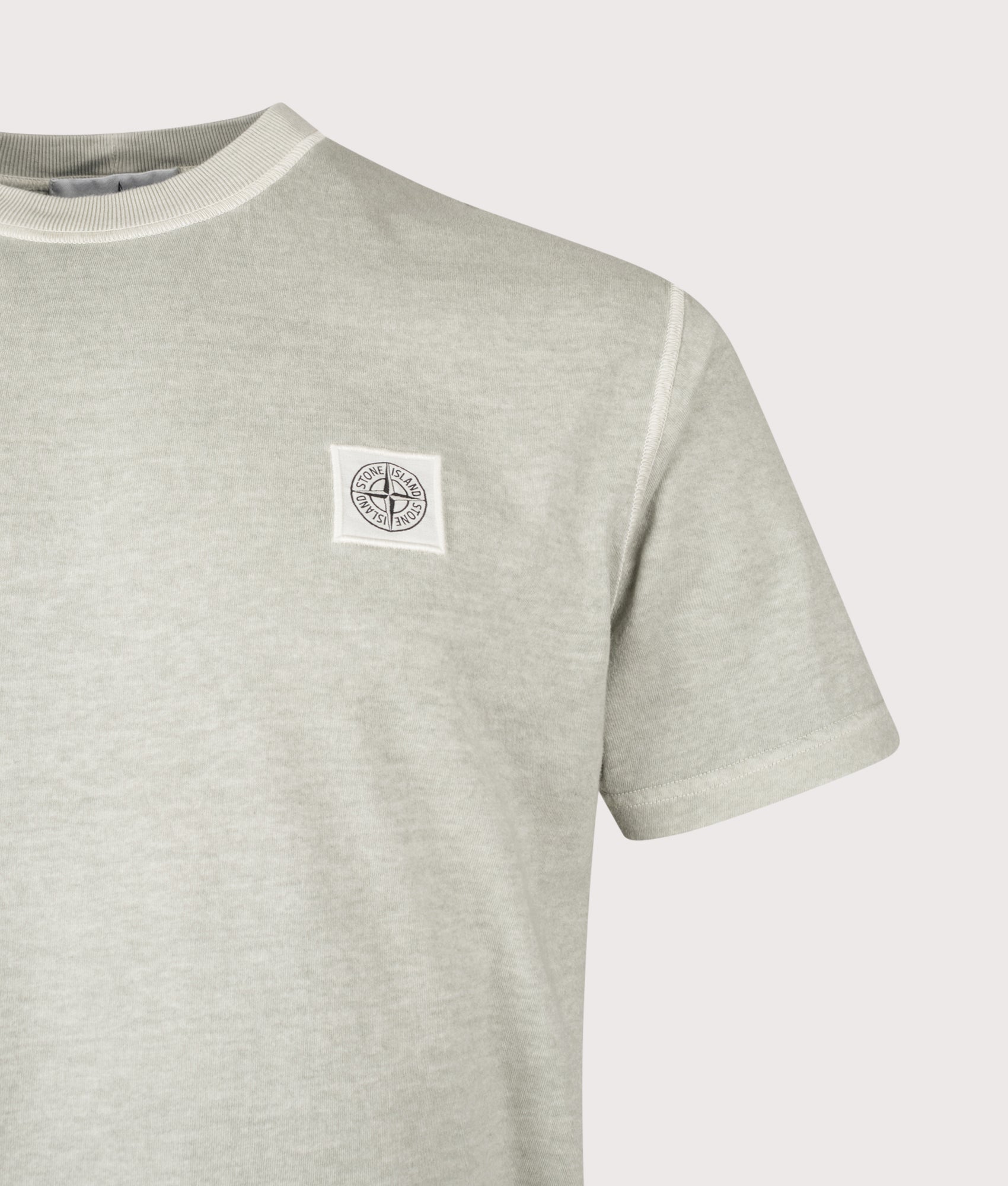 Stone Island Slim Fit ‘Fissato’ effect T-Shirt in Sage at EQVVS Menswear. Detail shot.