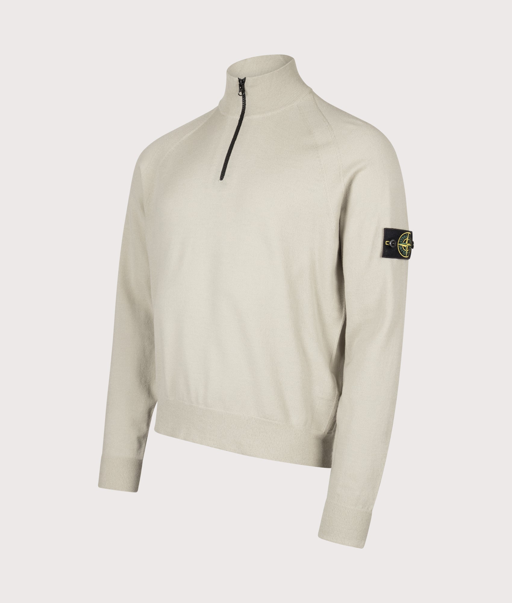Stone Island Stretch RWS Wool Quarter Zip Jumper in Sand at EQVVS Menswear. Angled front shot.