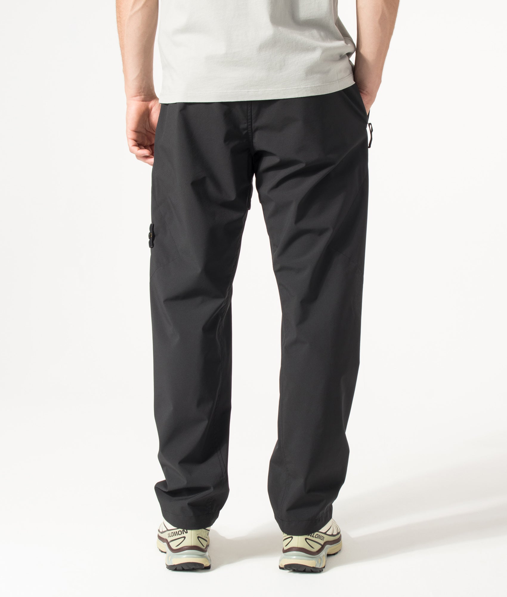 Stone Island Regular Fit Soft Shell-R_E. Dye® Technology Trousers in Black at EQVVS Menswear. Back shot.