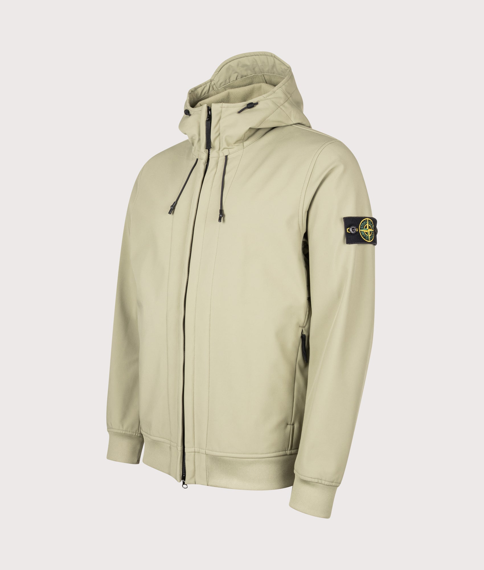 Stone Island Soft Shell-R_E DYE® Technology Jacket in Laurel Green at EQVVS Menswear. Angled front shot.