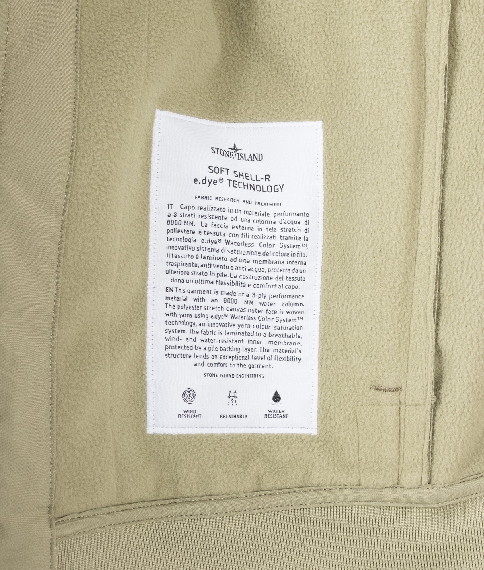 Stone Island Soft Shell-R_E DYE® Technology Jacket in Laurel Green at EQVVS Menswear. Label shot.