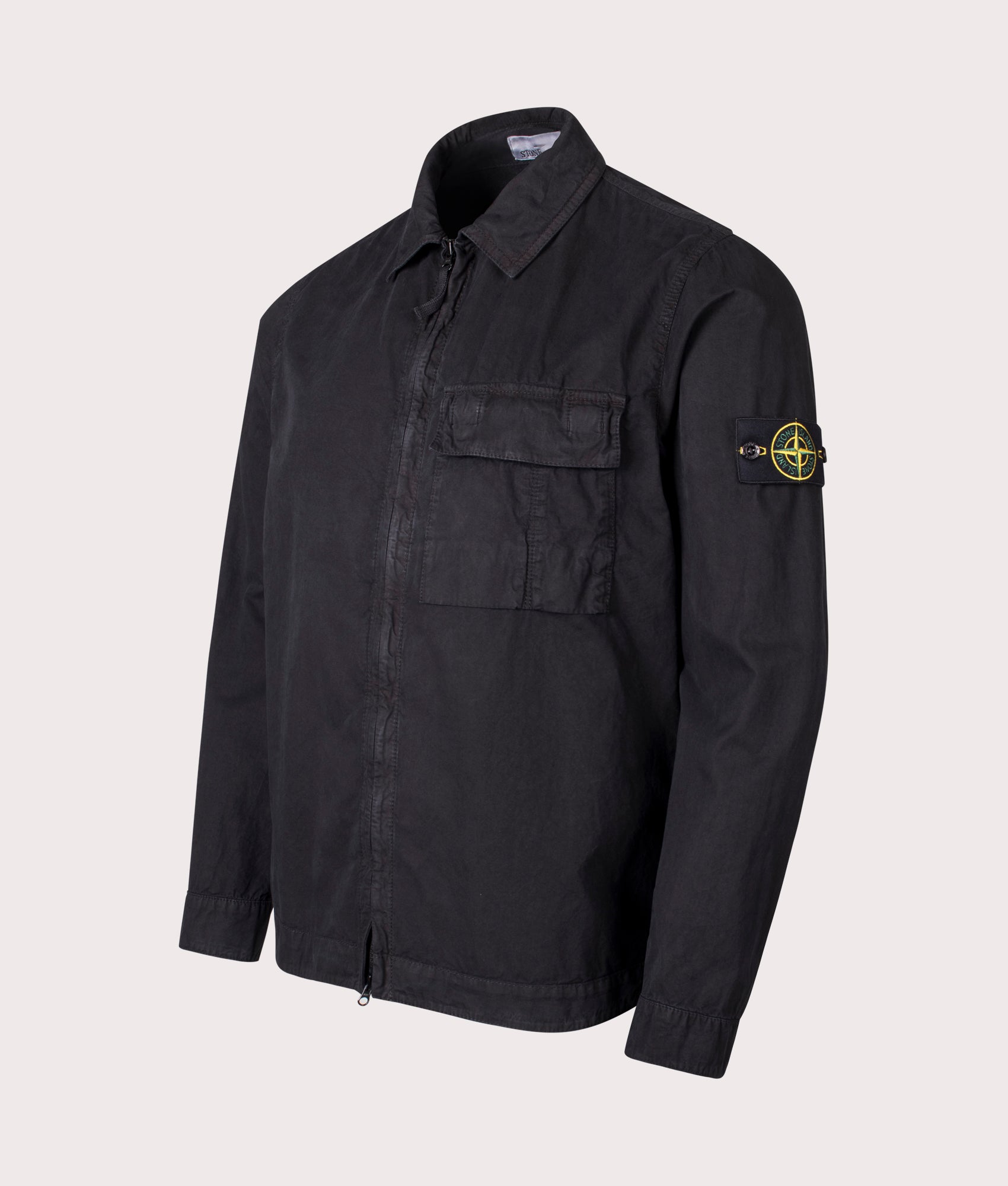 Stone Island Brushed Organic Cotton Canvas ‘OLD’ Effect Overshirt in Black at EQVVS Menswear. Angled front shot.