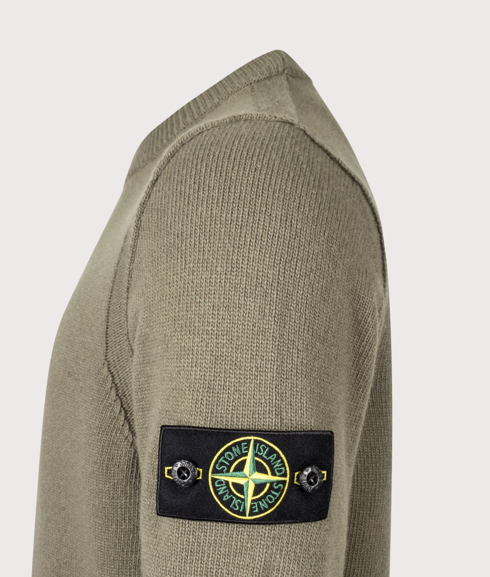 Stone Island Lambswool Crewneck Jumper in Military Green at EQVVS Menswear. Detail shot.
