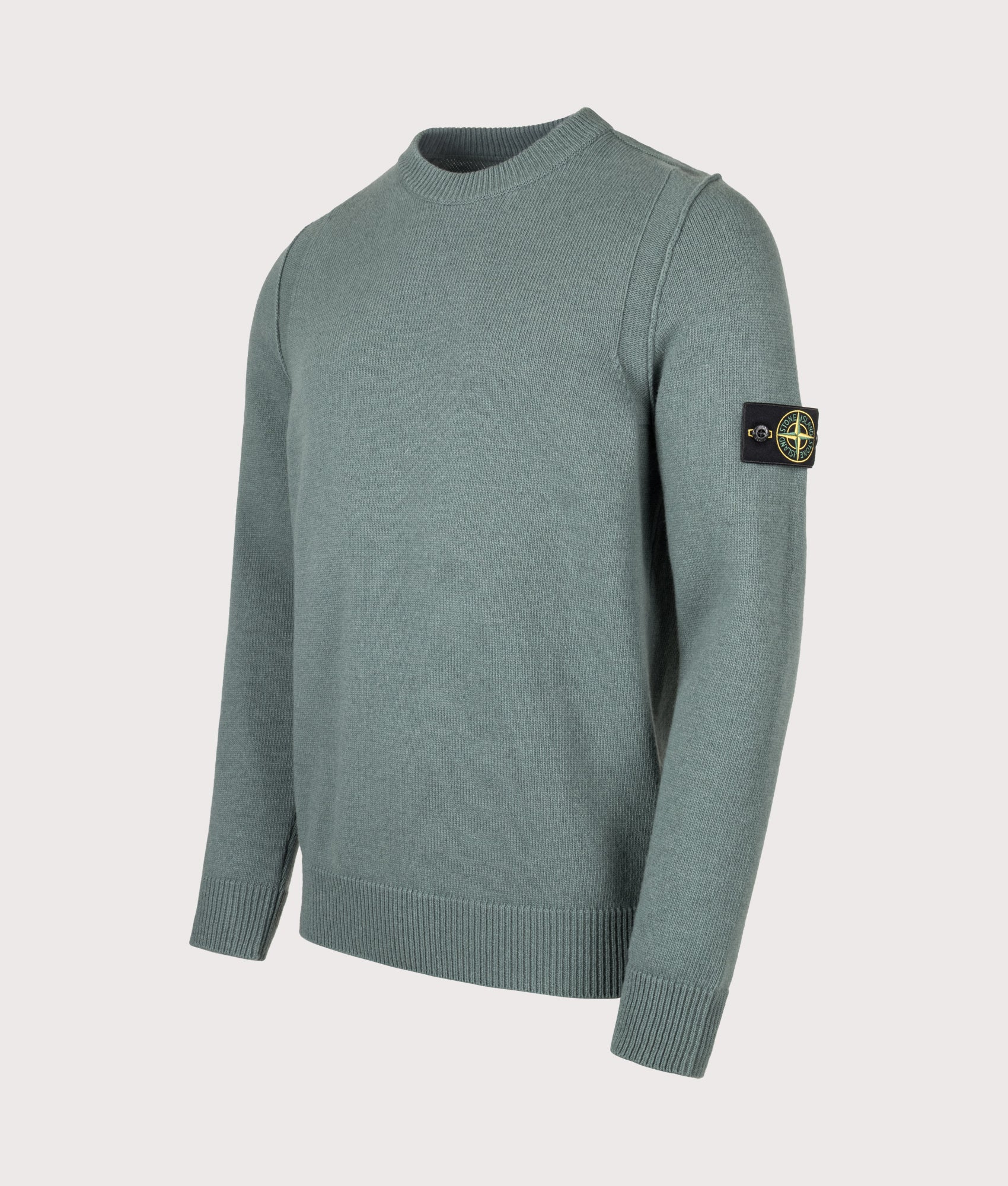 Stone Island Lambswool Crewneck Jumper in Ocean Green at EQVVS Menswear. Angled front shot.
