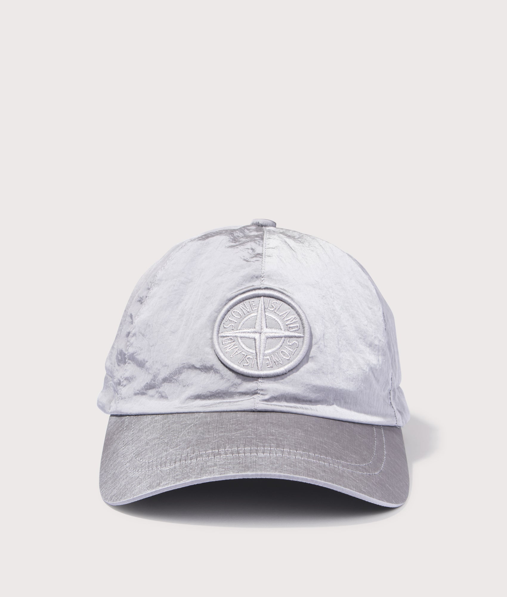 Stone Island Nylon Metal Baseball Cap in Pearl Grey at EQVVS Menswear. Front shot. 