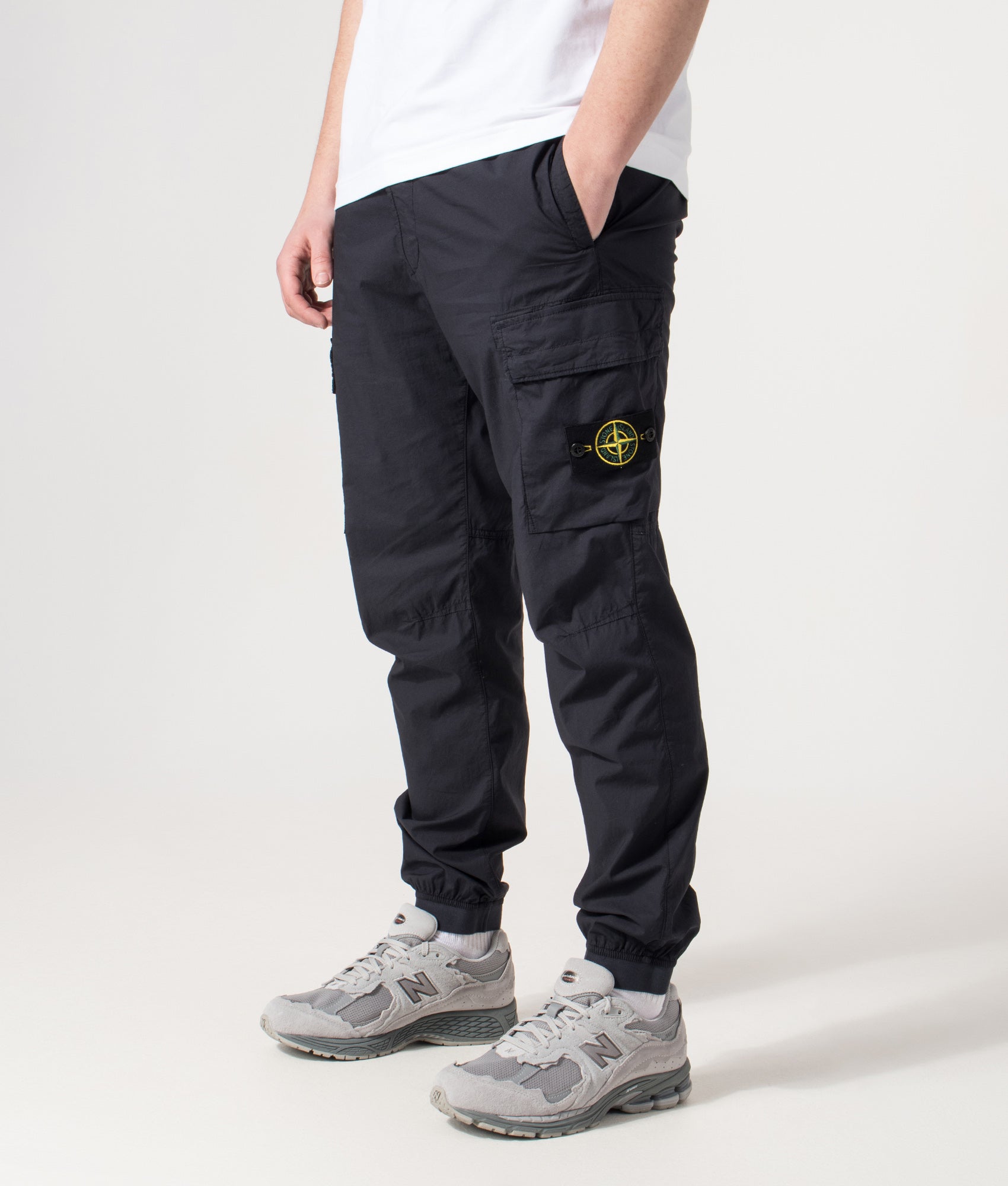 Stone Island Tapered Cargo Pants in Navy Blue at EQVVS Menswear. Angled front shot.